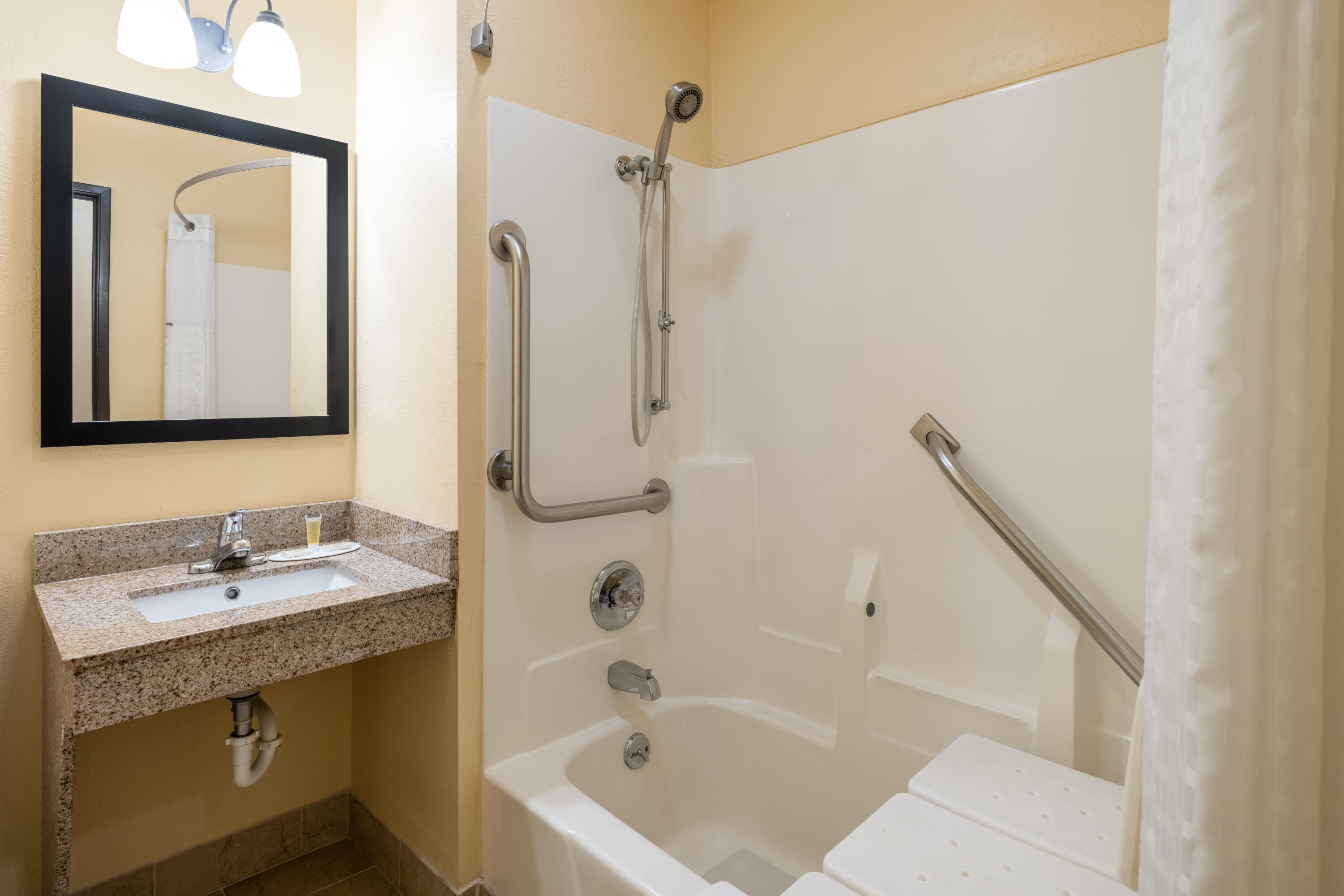 Guest room bath at the Super 8 by Wyndham Mattoon in Mattoon, Illinois