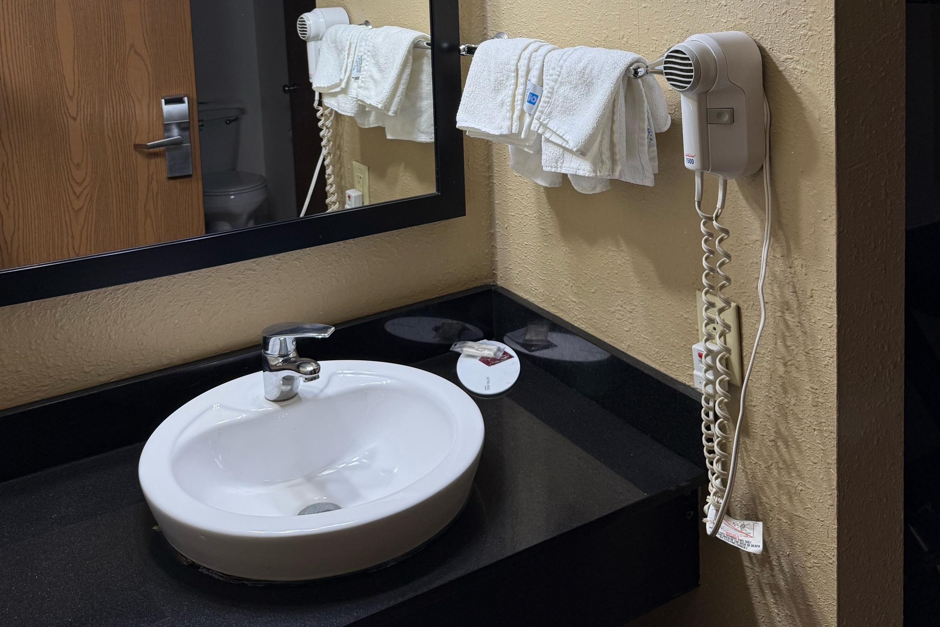 Guest room bath at the Super 8 by Wyndham Mendota I-39 in Mendota, Illinois