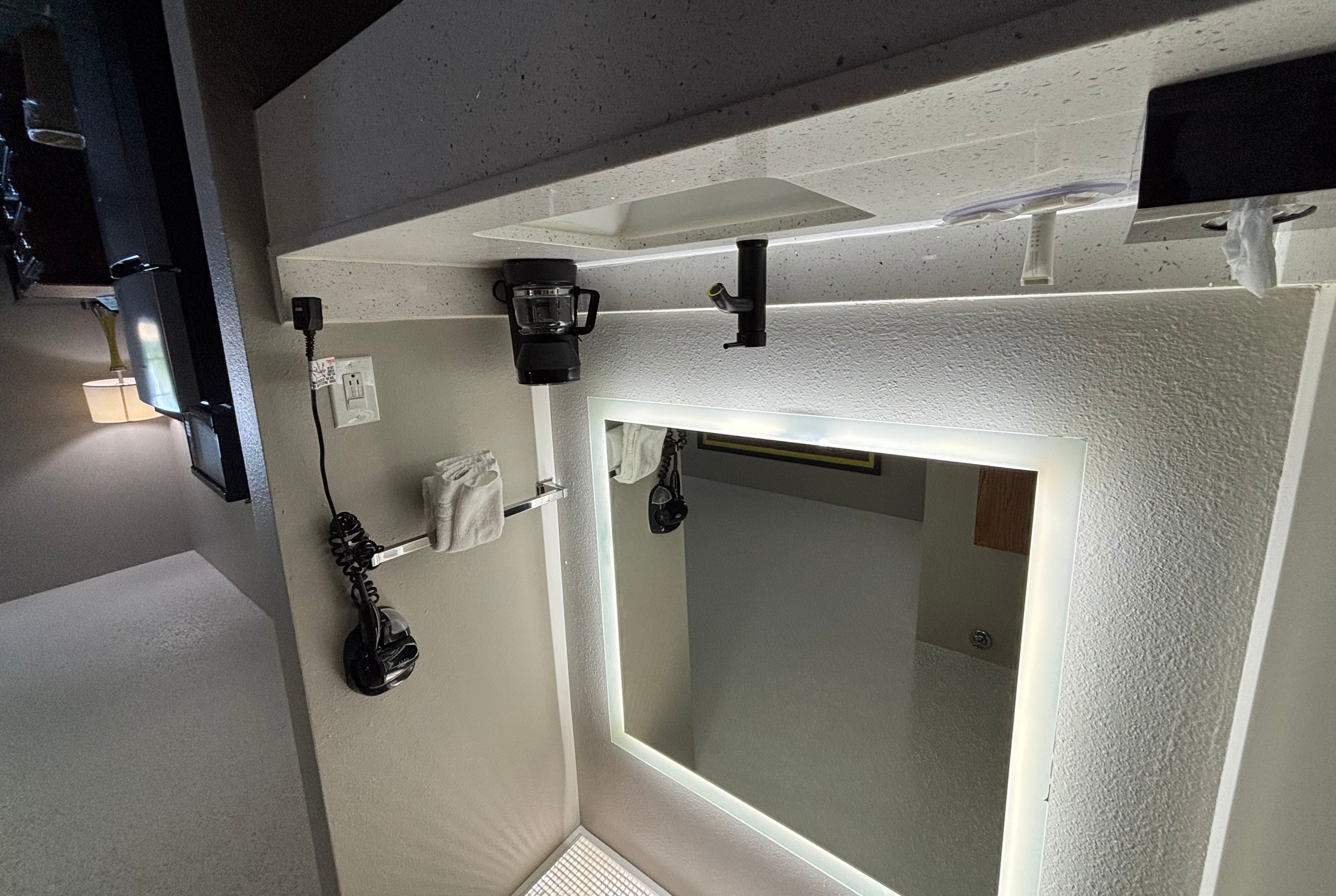 Guest room bath at the Super 8 by Wyndham Mt. Carmel IL in Mount Carmel, Illinois