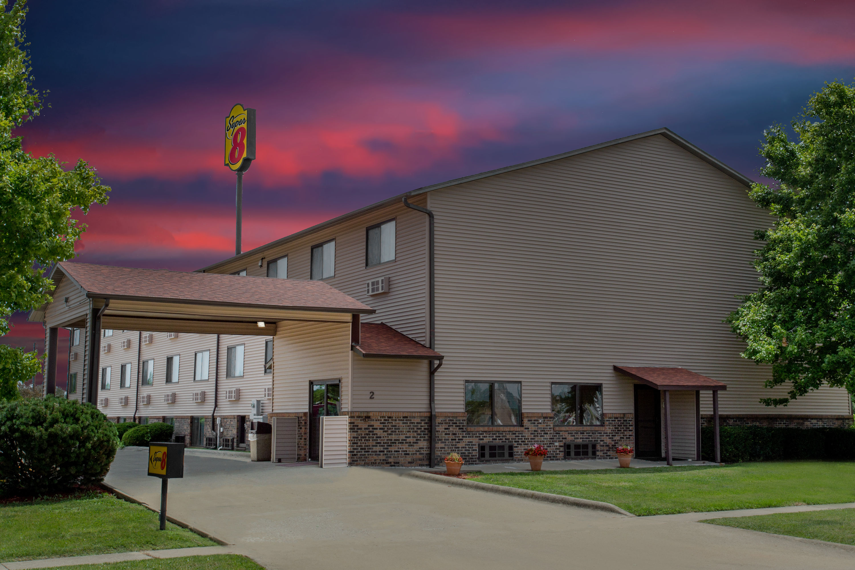 Exterior Dusk Image of Super 8 by Wyndham Normal Bloomington hotel in Normal, Illinois