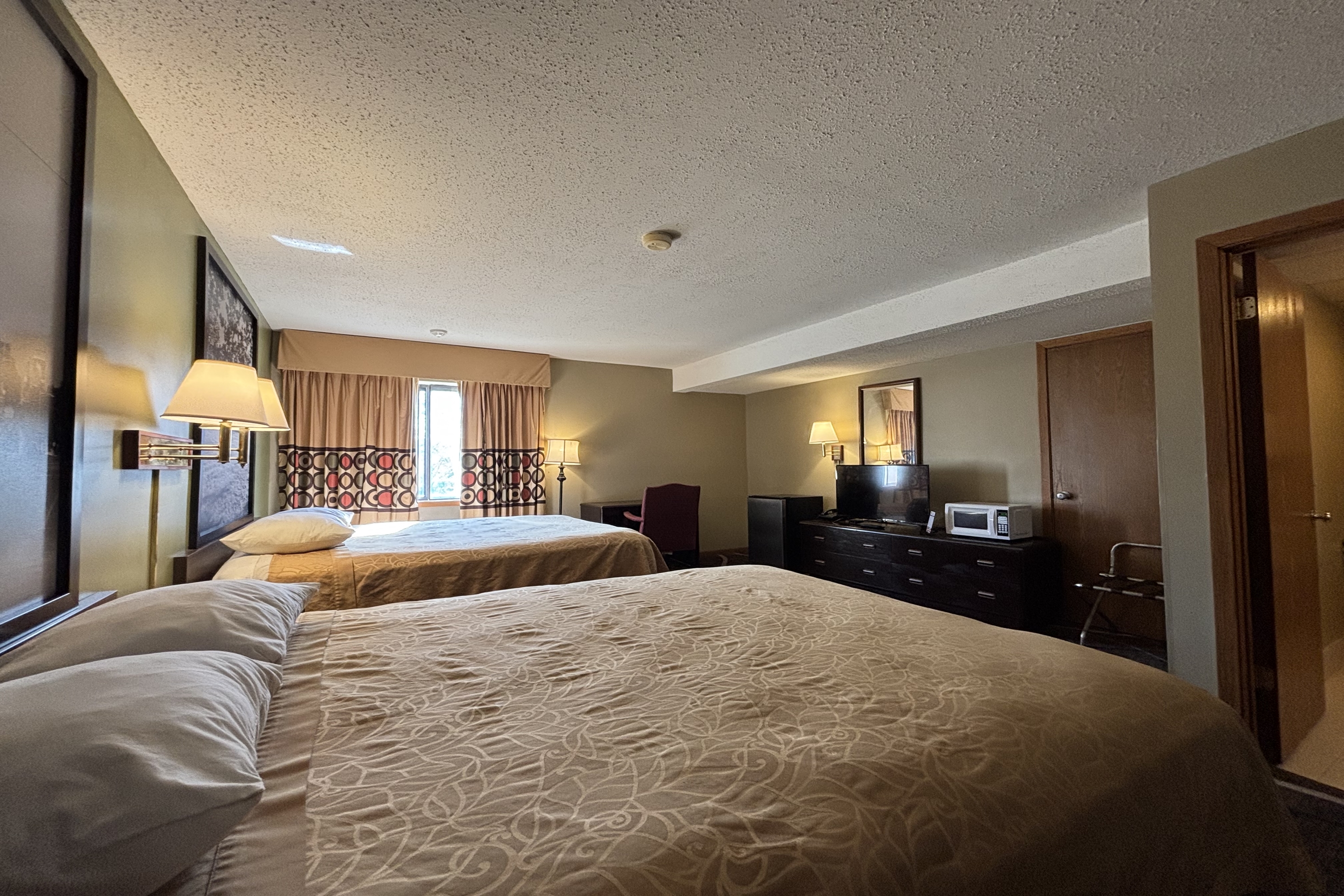 Guest room at the Super 8 by Wyndham Normal Bloomington in Normal, Illinois
