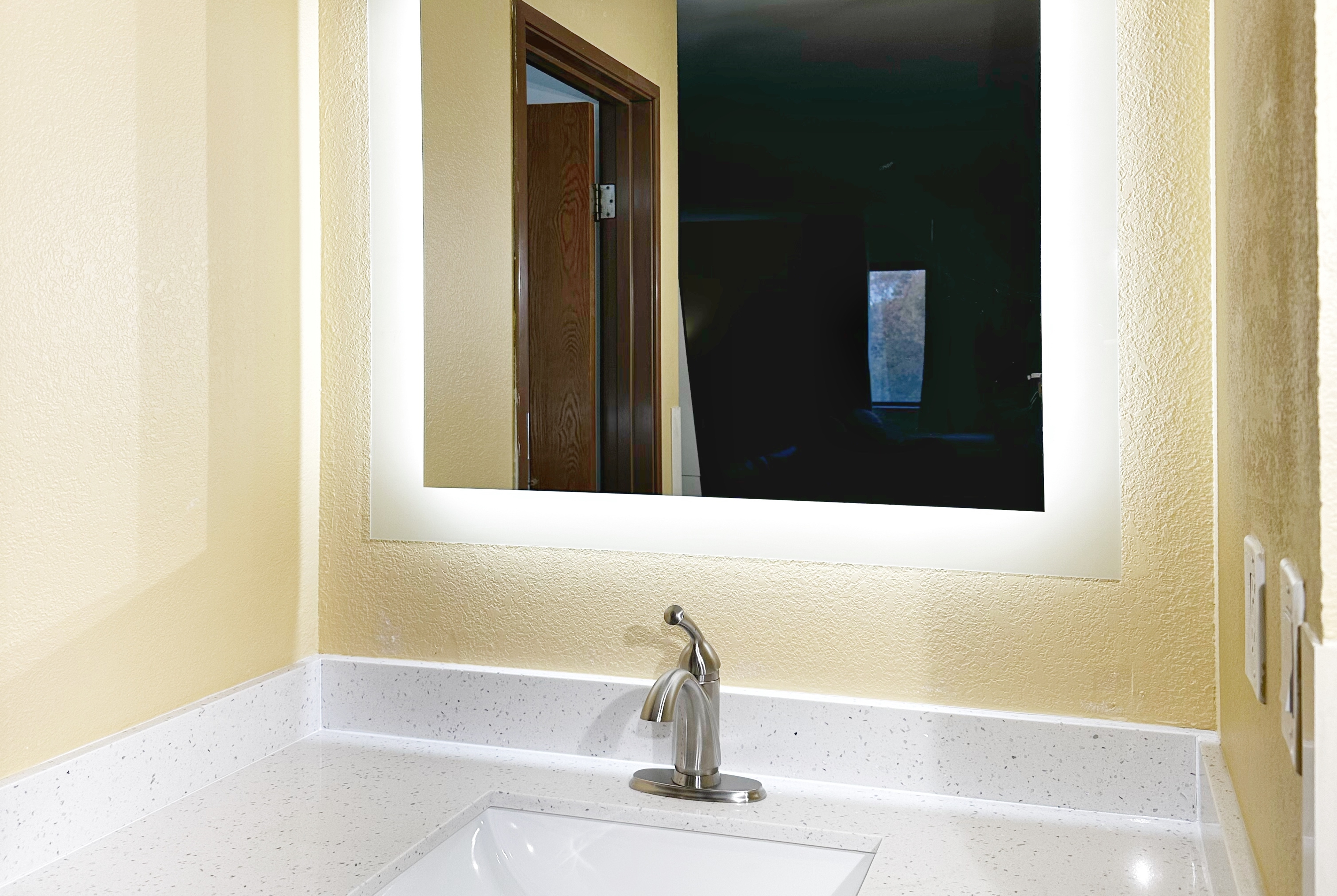 Guest room bath at the Super 8 by Wyndham Peoria in Peoria, Illinois