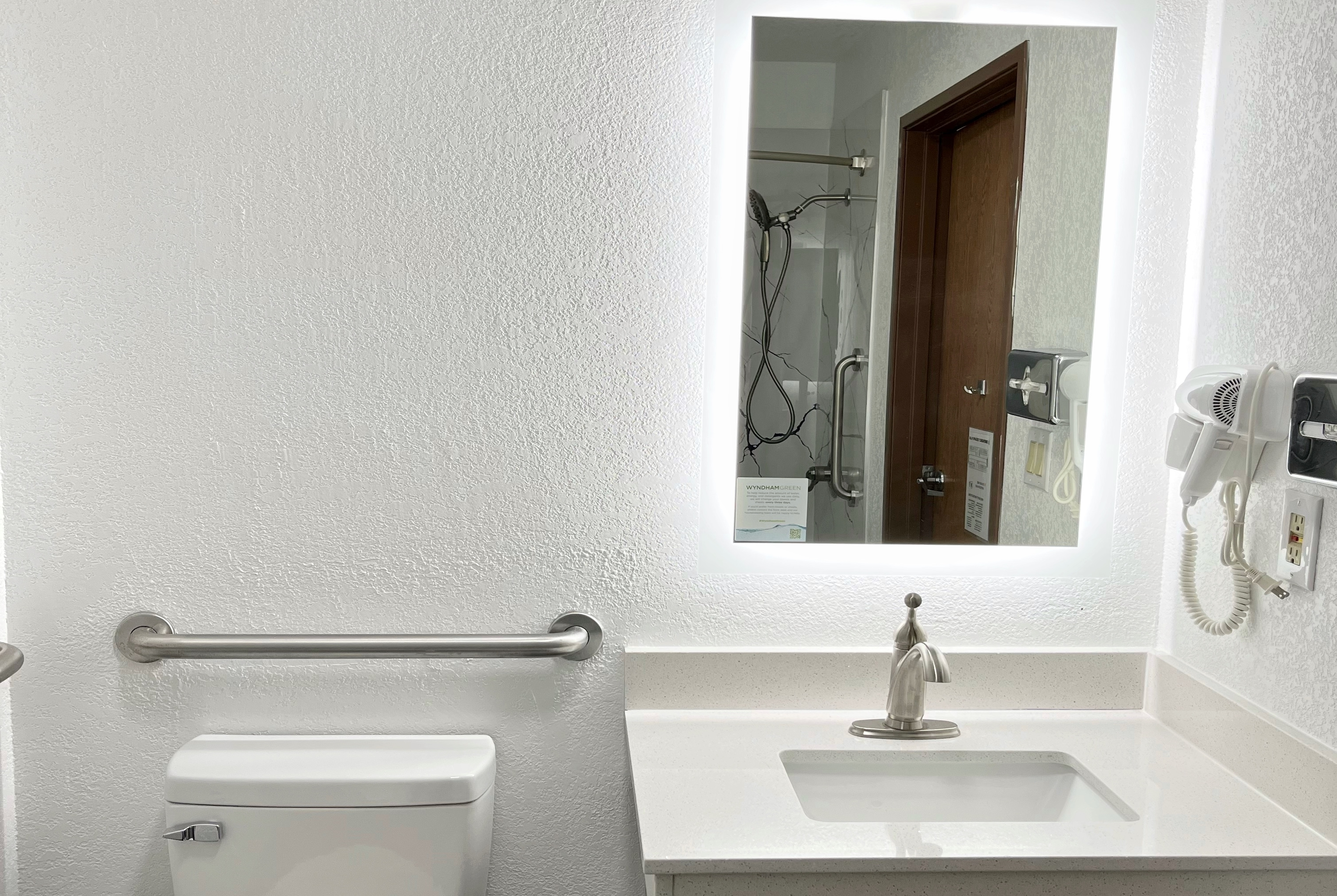 Guest room bath at the Super 8 by Wyndham Peoria in Peoria, Illinois