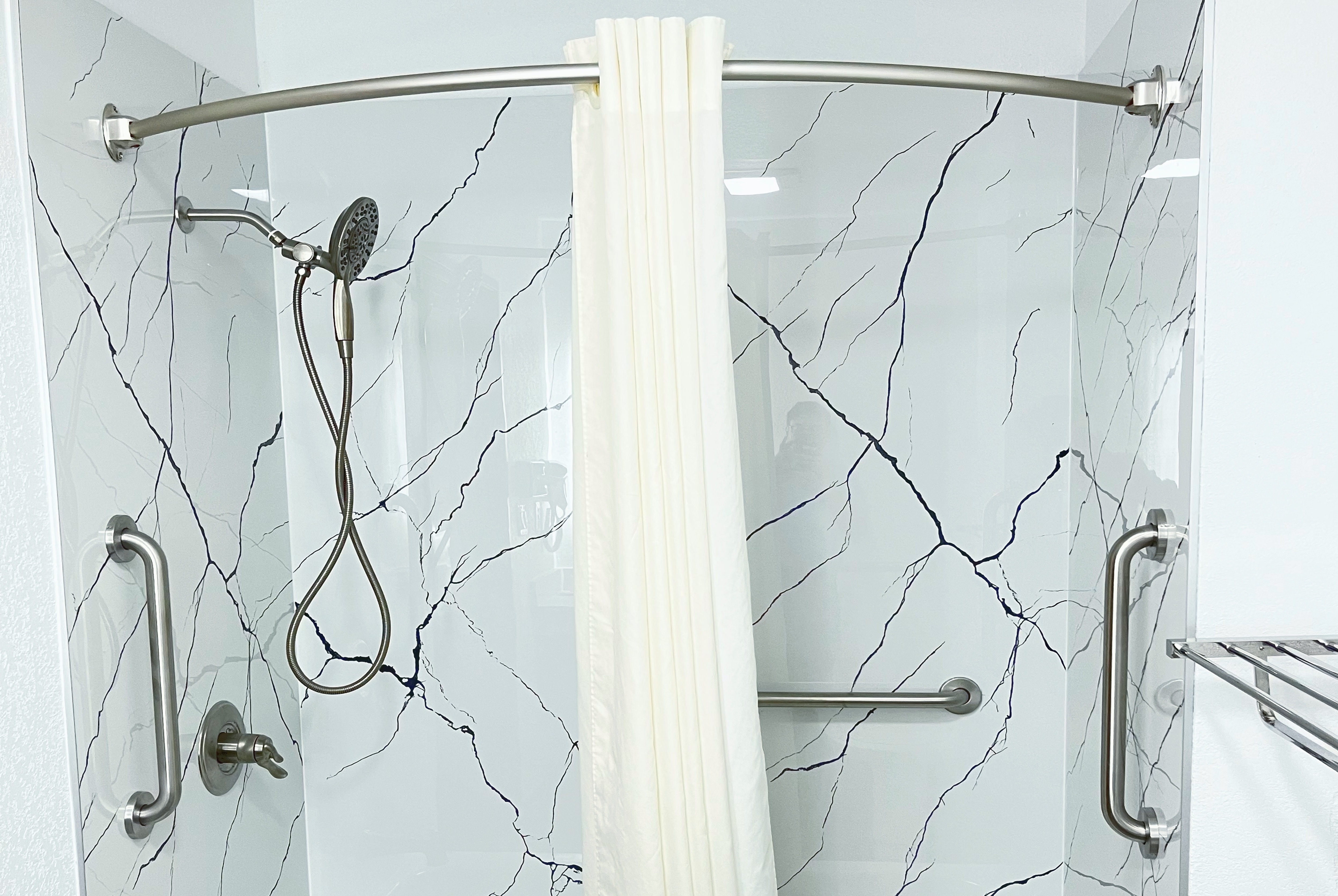 Guest room bath at the Super 8 by Wyndham Peoria in Peoria, Illinois