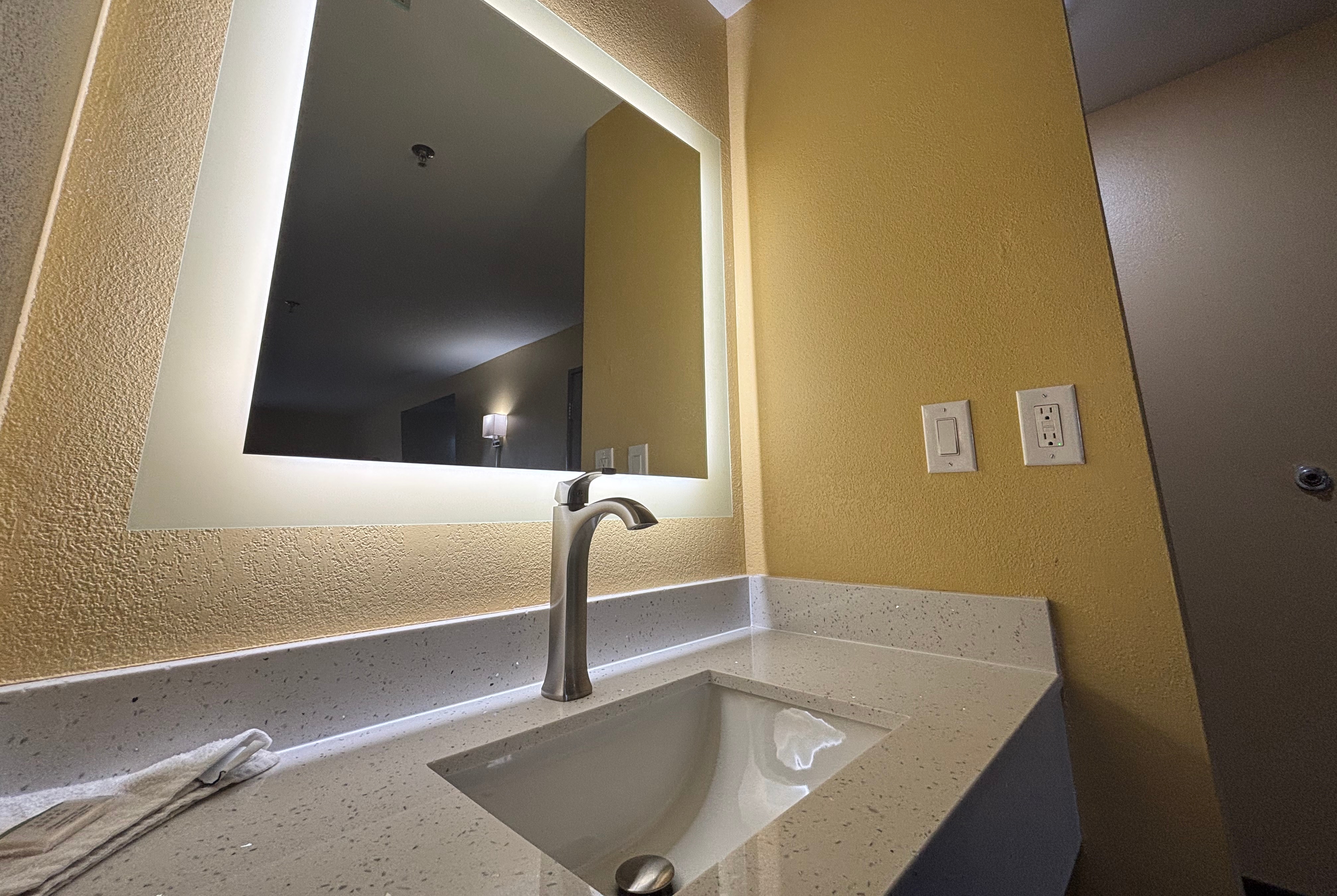 Guest room bath at the Super 8 by Wyndham Peoria in Peoria, Illinois