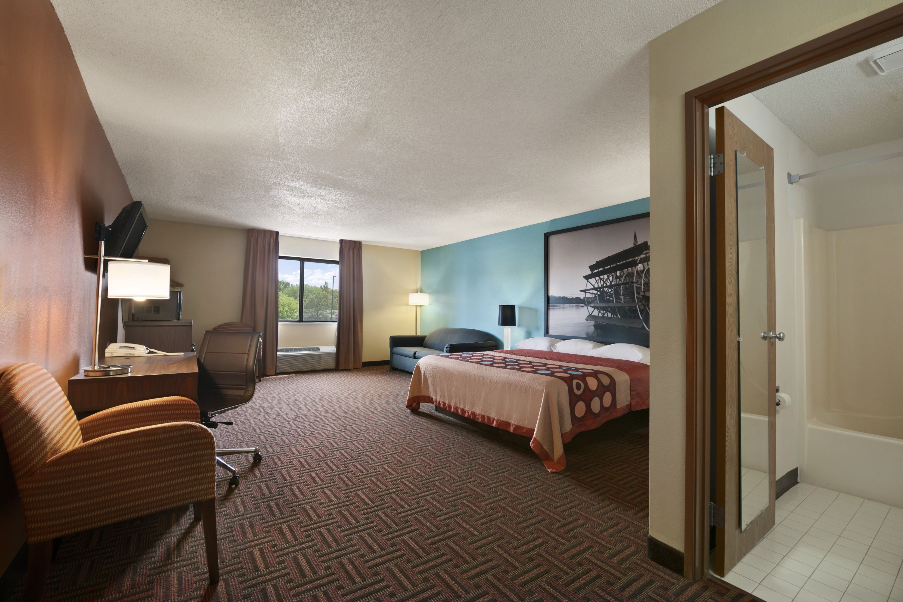 Guest room at the Super 8 by Wyndham Peoria in Peoria, Illinois