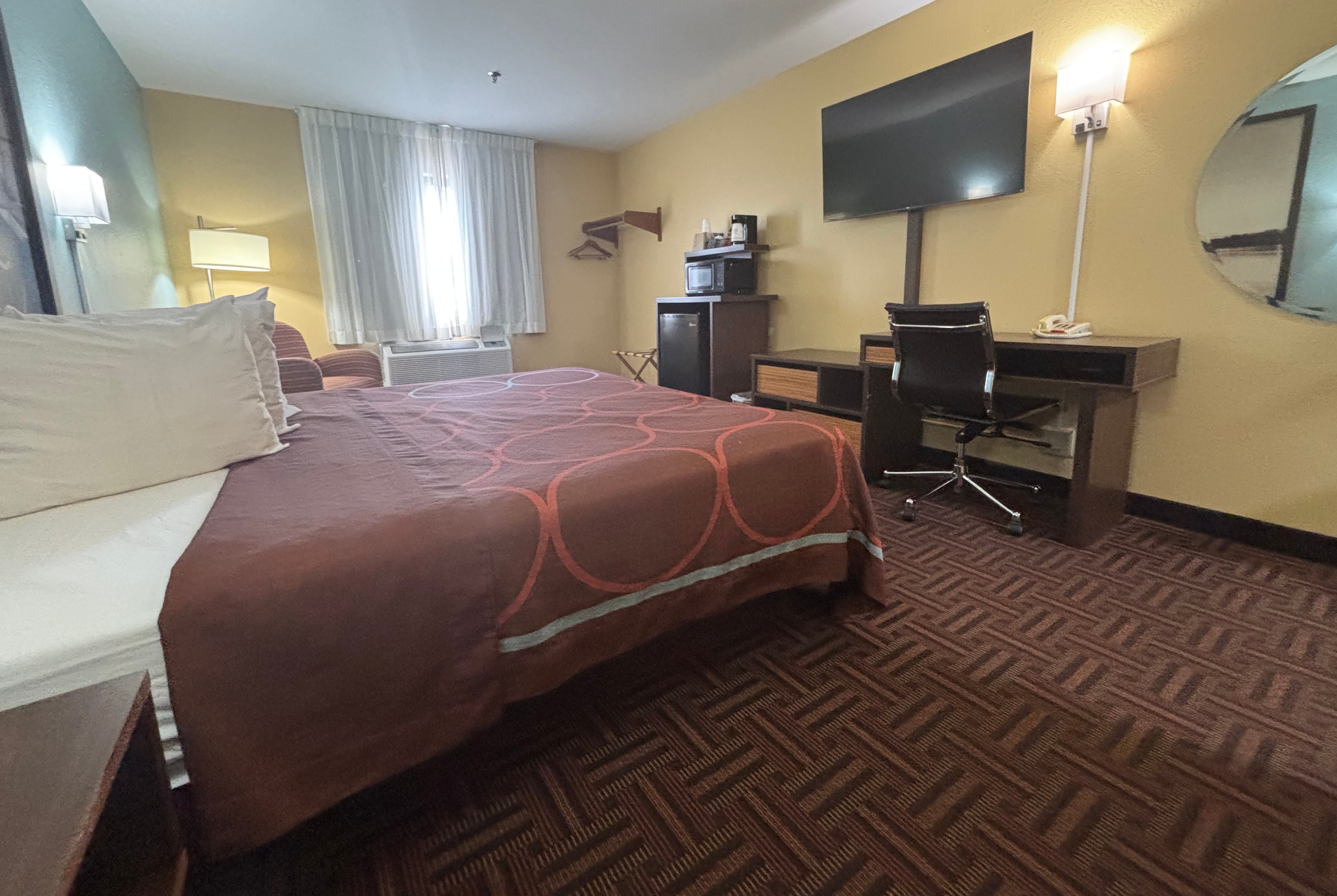 Guest room at the Super 8 by Wyndham Peoria in Peoria, Illinois