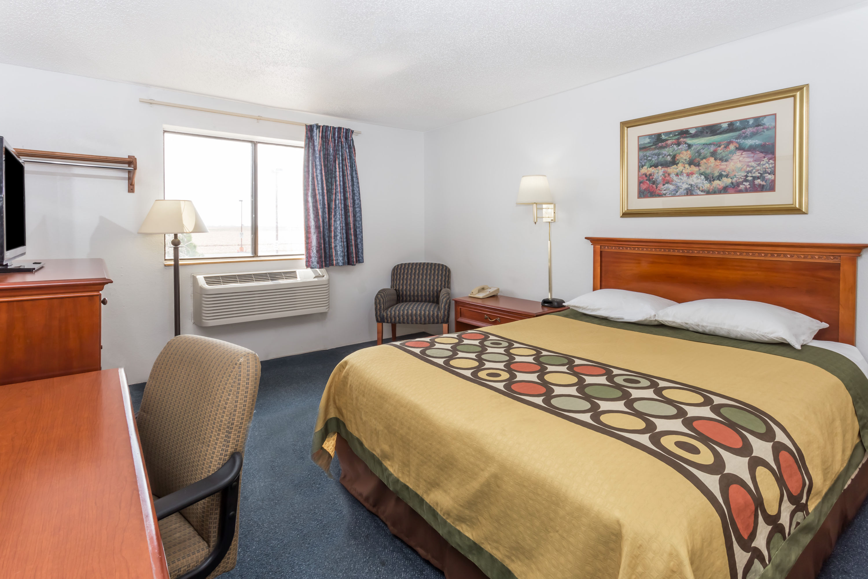 Guest room at the Super 8 by Wyndham Pontiac in Pontiac, Illinois