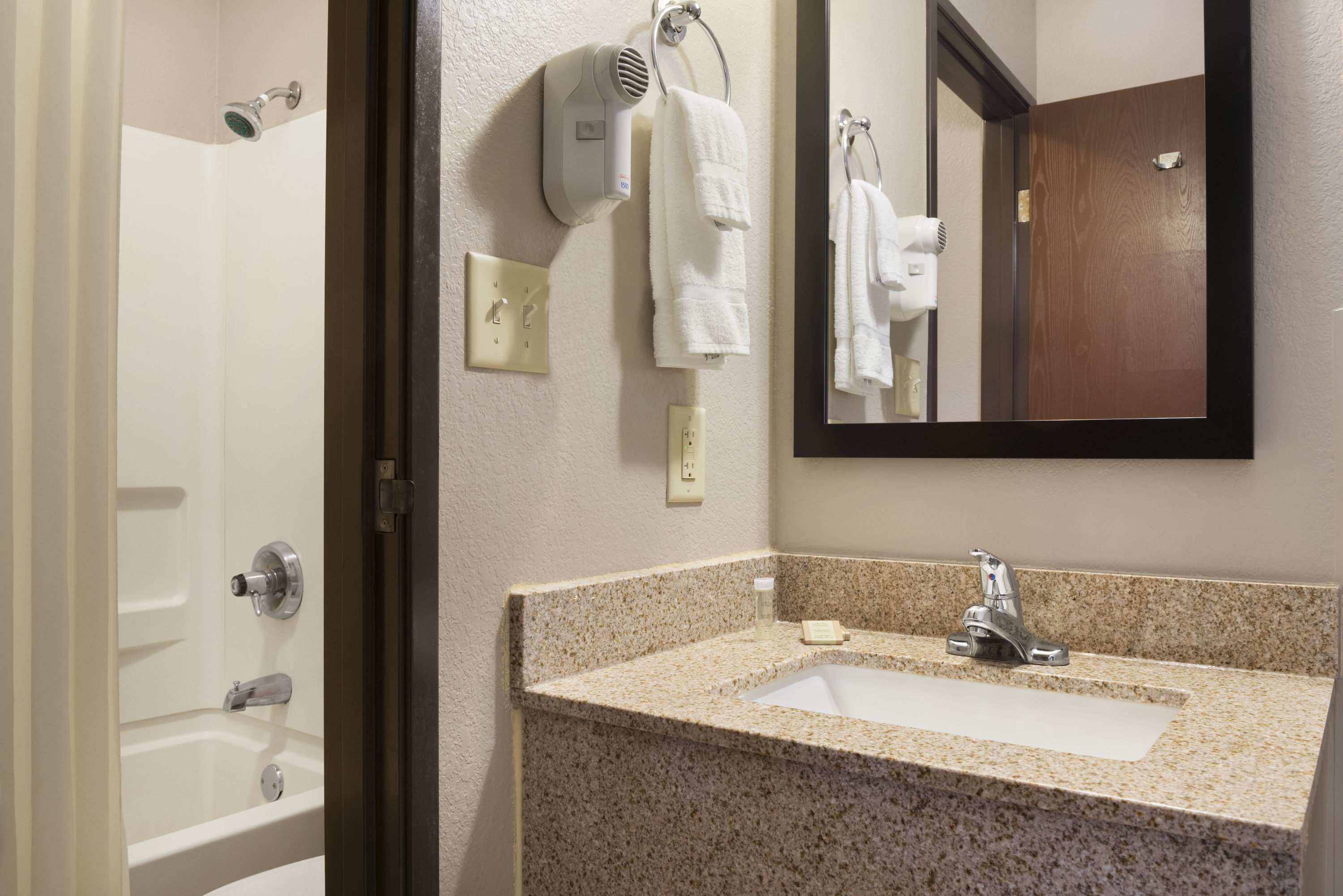Guest room bath at the Super 8 by Wyndham Rantoul in Rantoul, Illinois