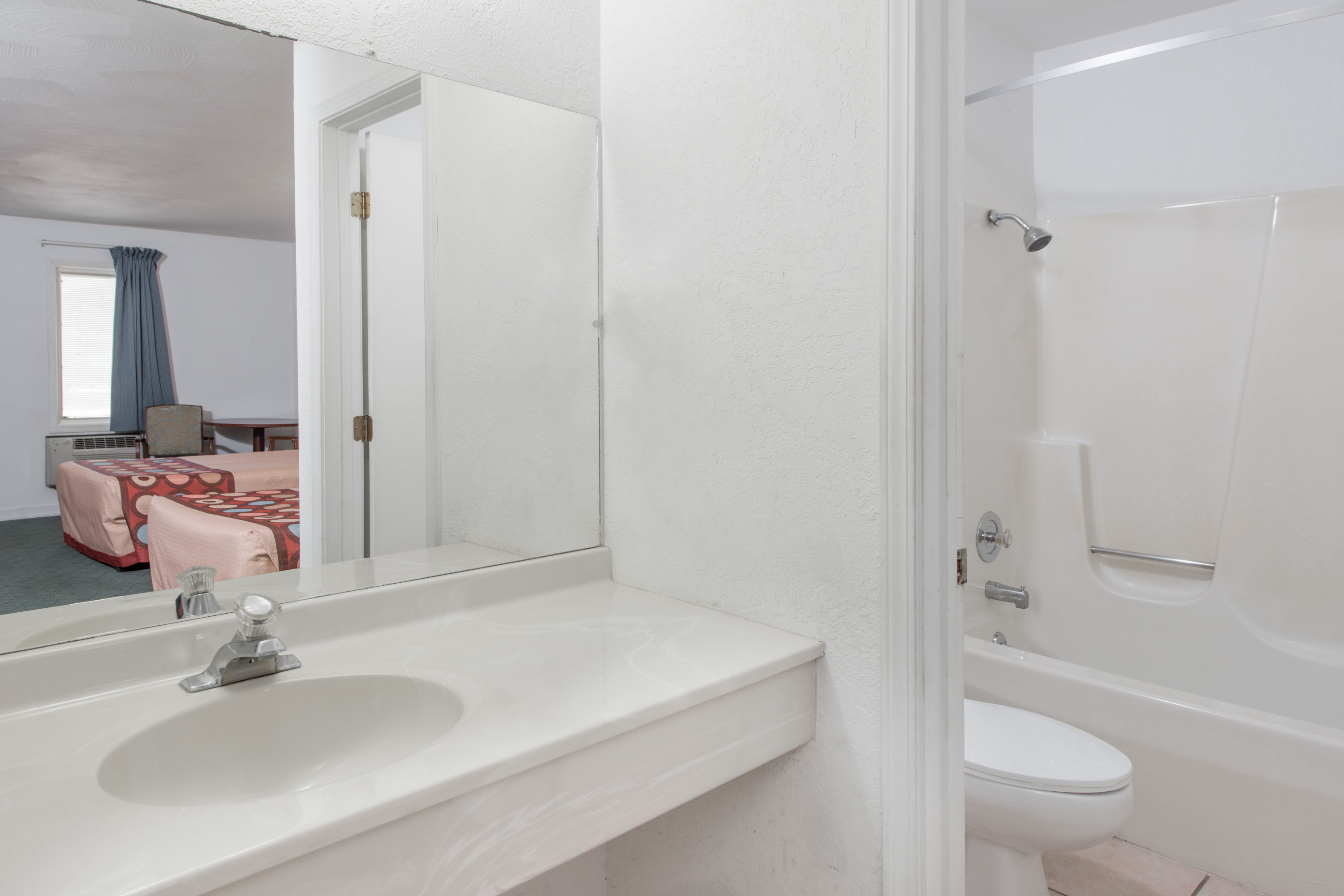 Guest room bath at the Super 8 by Wyndham Taylorville IL in Taylorville, Illinois