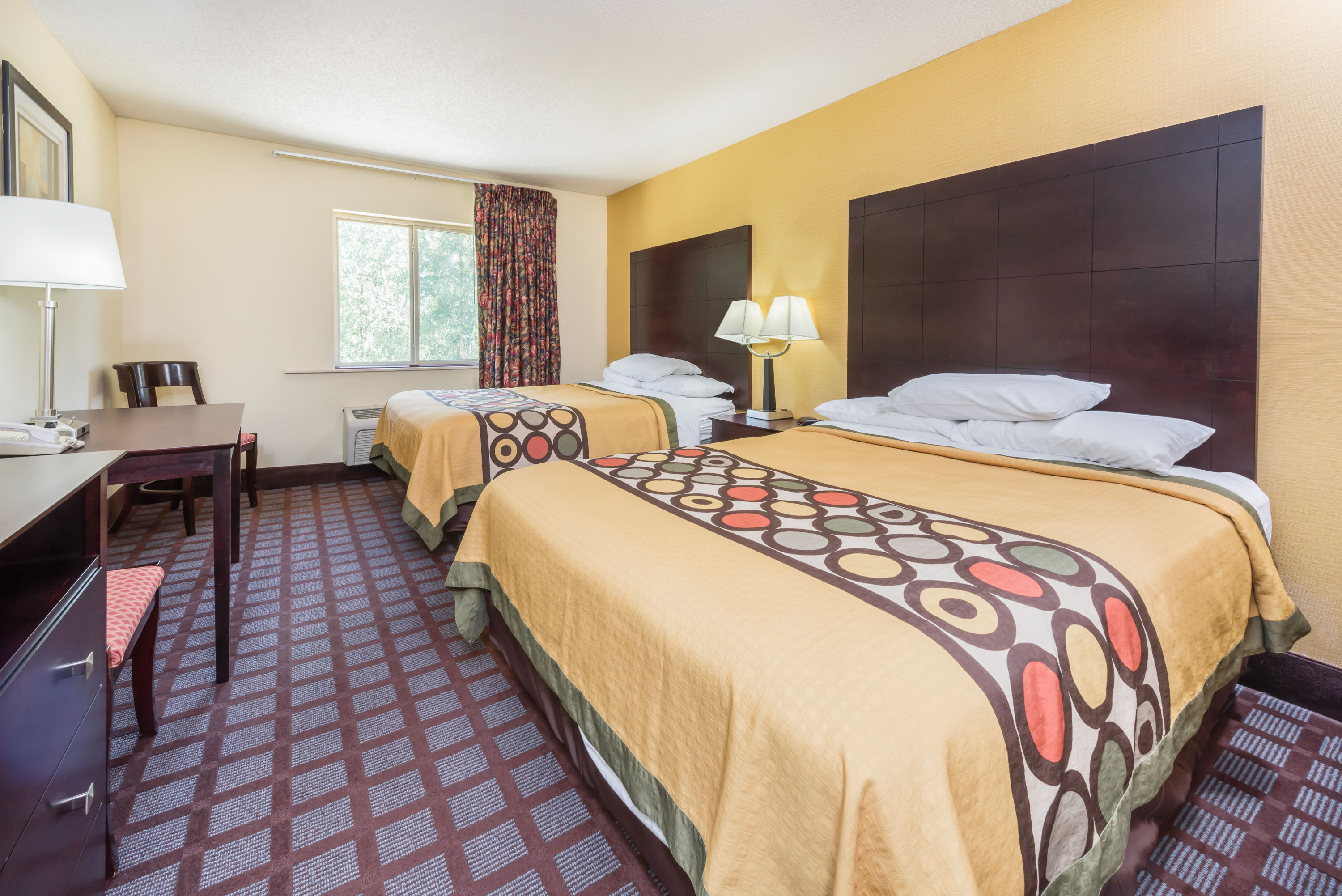 Guest room at the Super 8 by Wyndham Bloomington University Area in Bloomington, Indiana