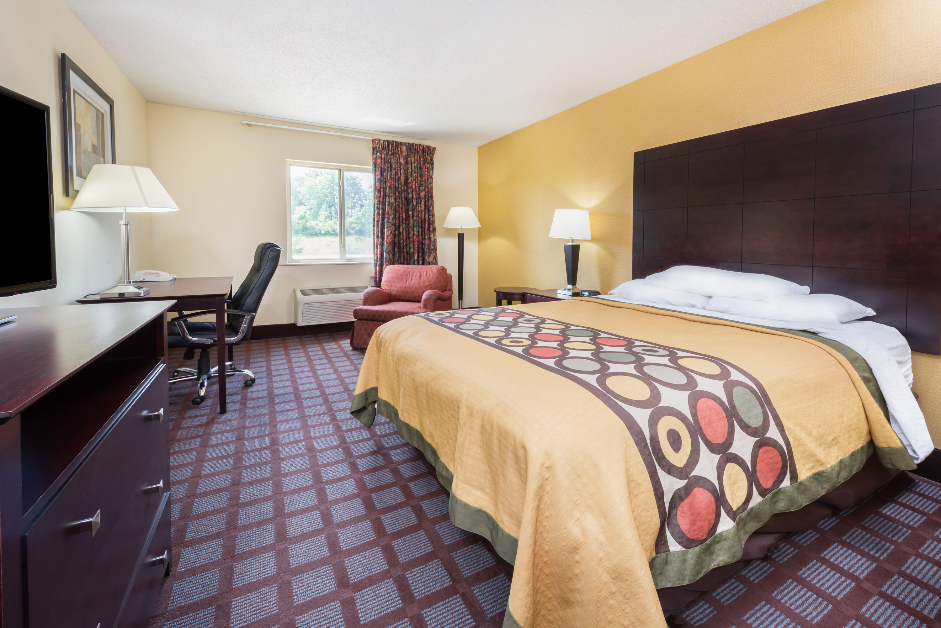 Guest room at the Super 8 by Wyndham Bloomington University Area in Bloomington, Indiana