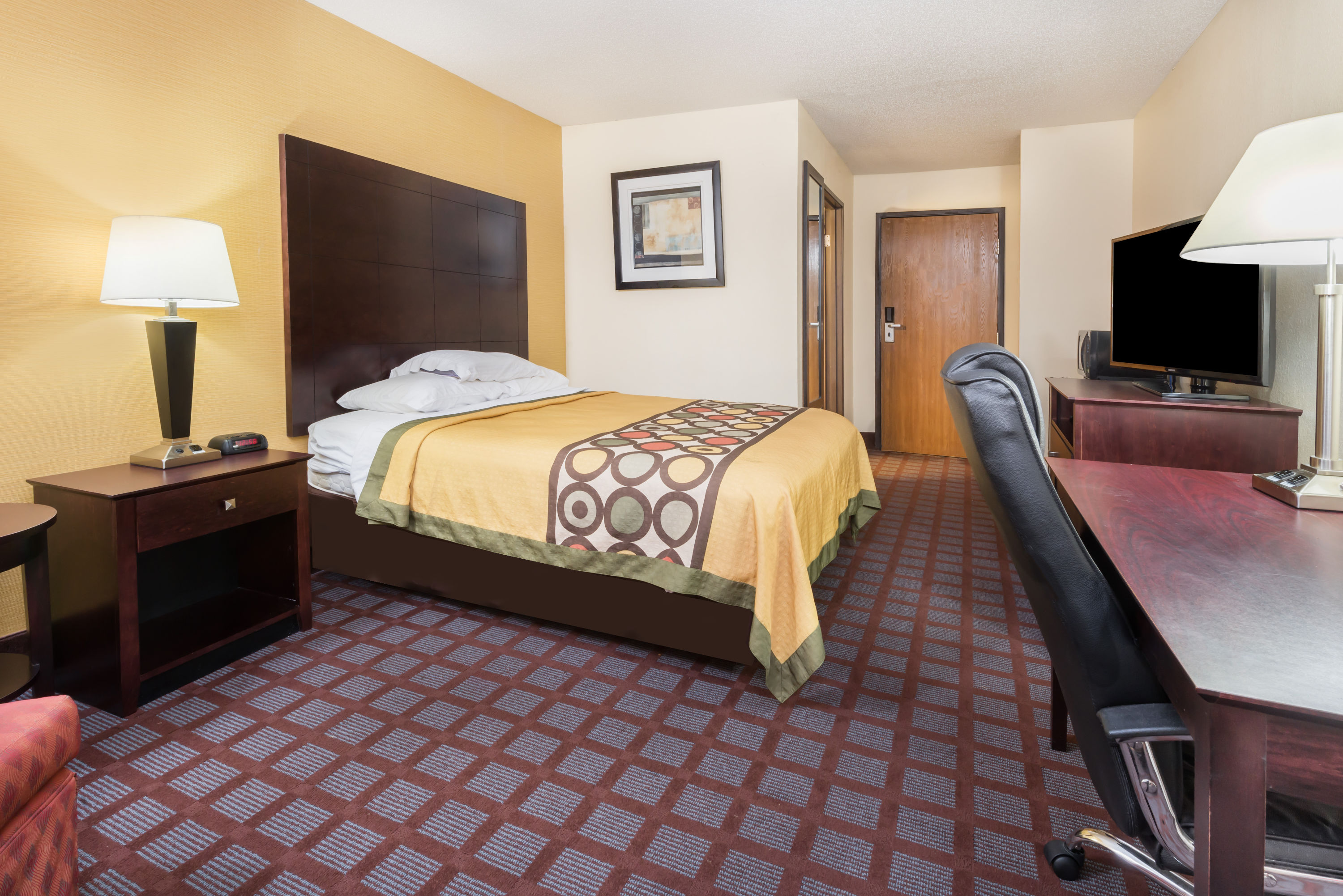 Guest room at the Super 8 by Wyndham Bloomington University Area in Bloomington, Indiana