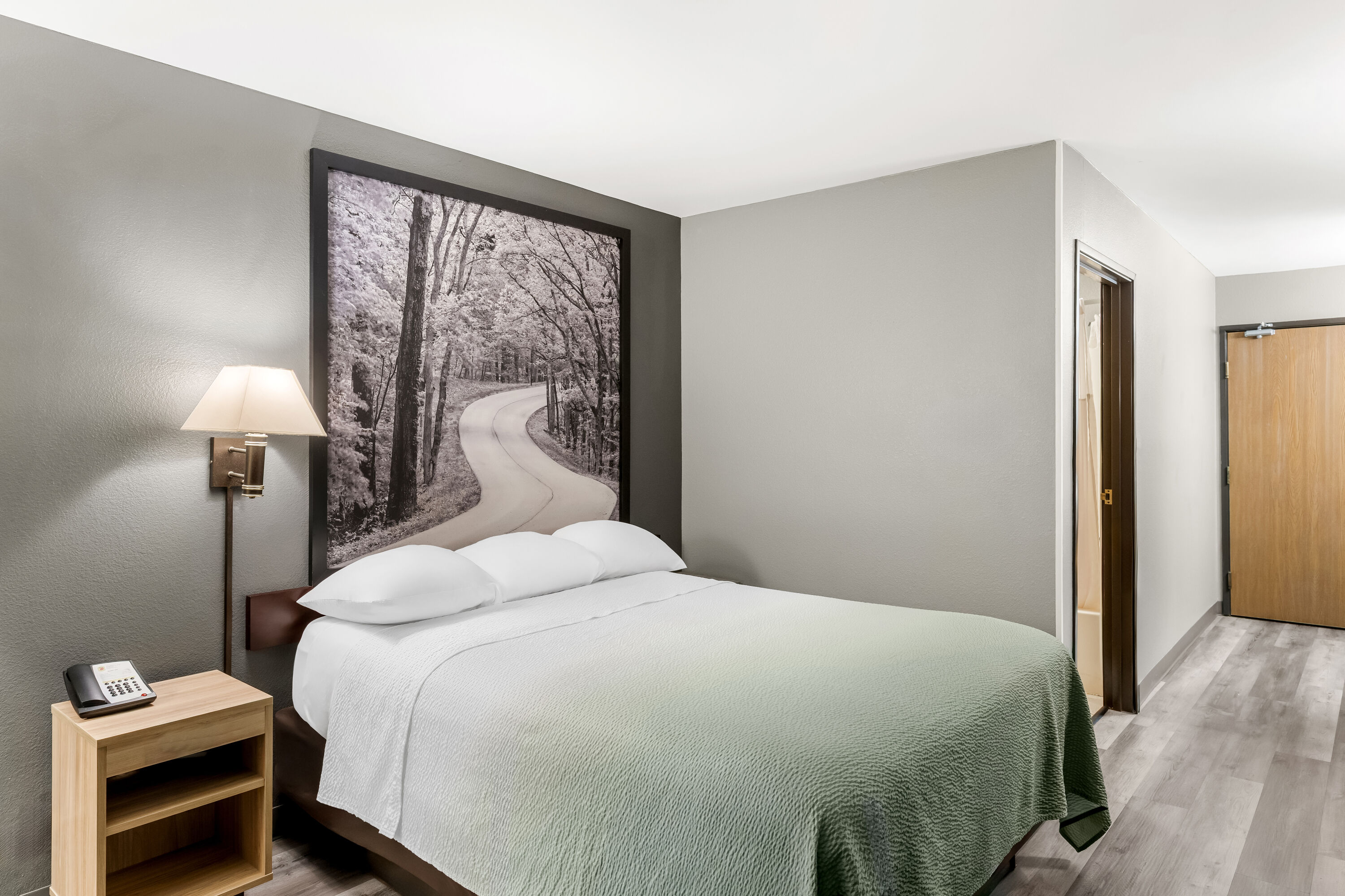 Queen bed guest room at the Super 8 by Wyndham Cloverdale IN in Cloverdale, Indiana