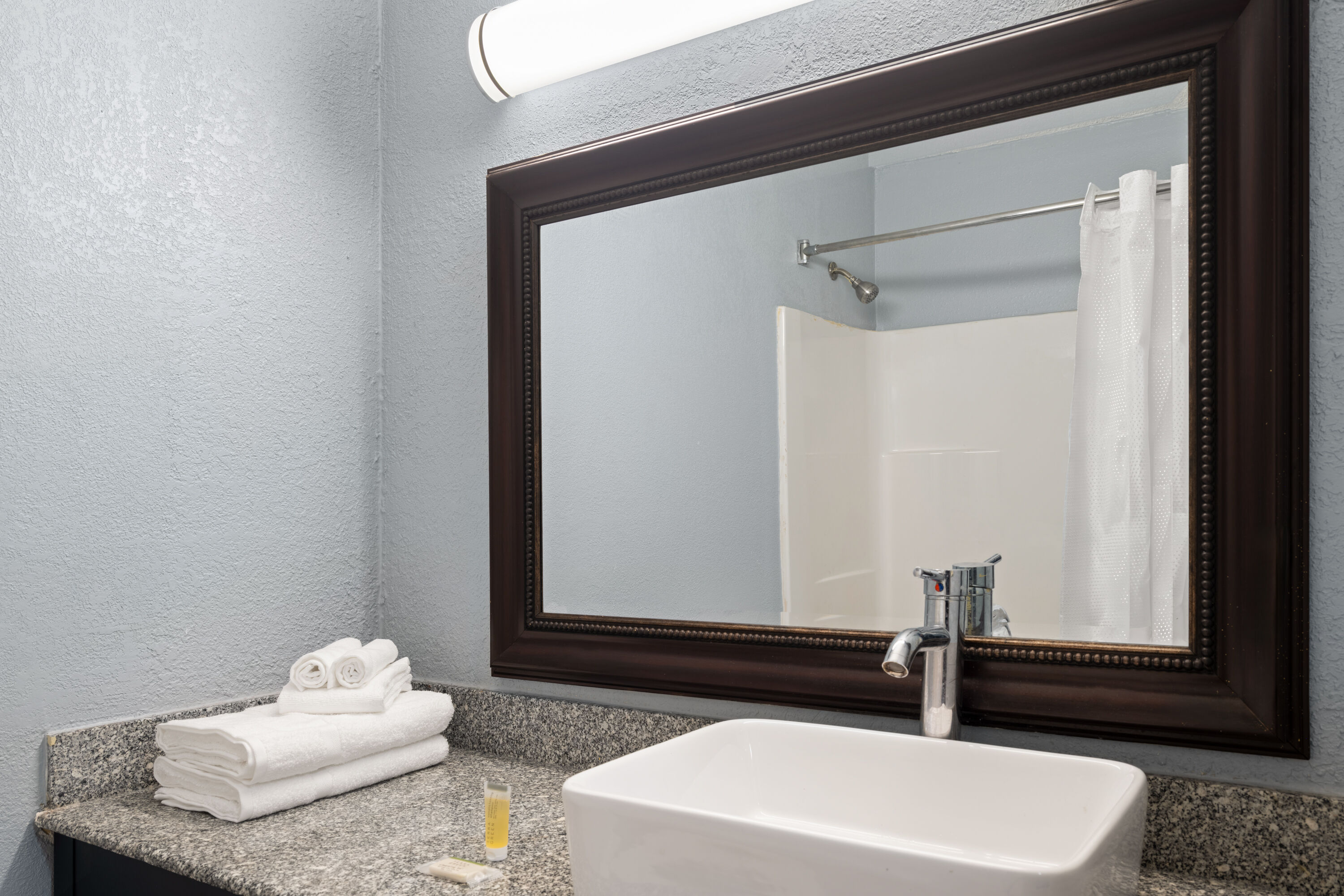 Guest room bath at the Super 8 by Wyndham Fort Wayne in Fort Wayne, Indiana