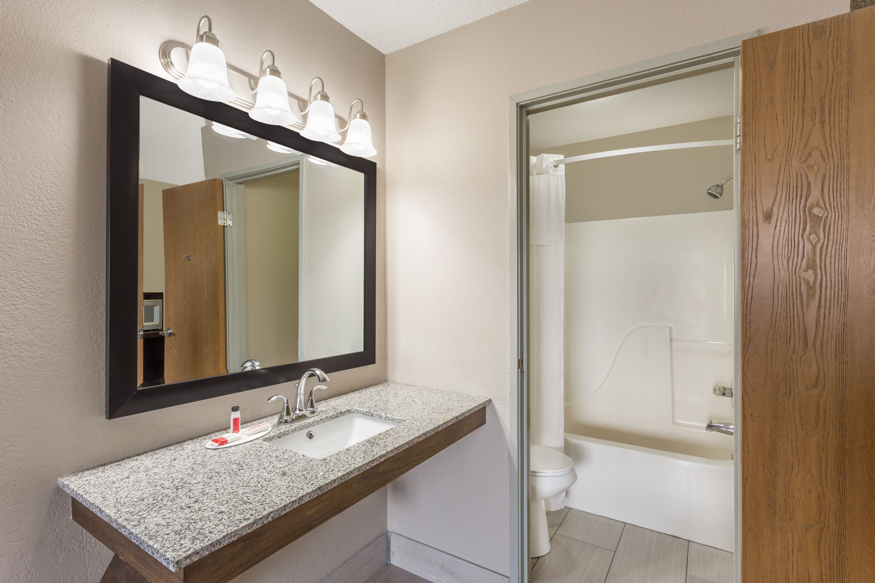 Guest room bath at the Super 8 by Wyndham Hebron Lowell Area in Hebron, Indiana