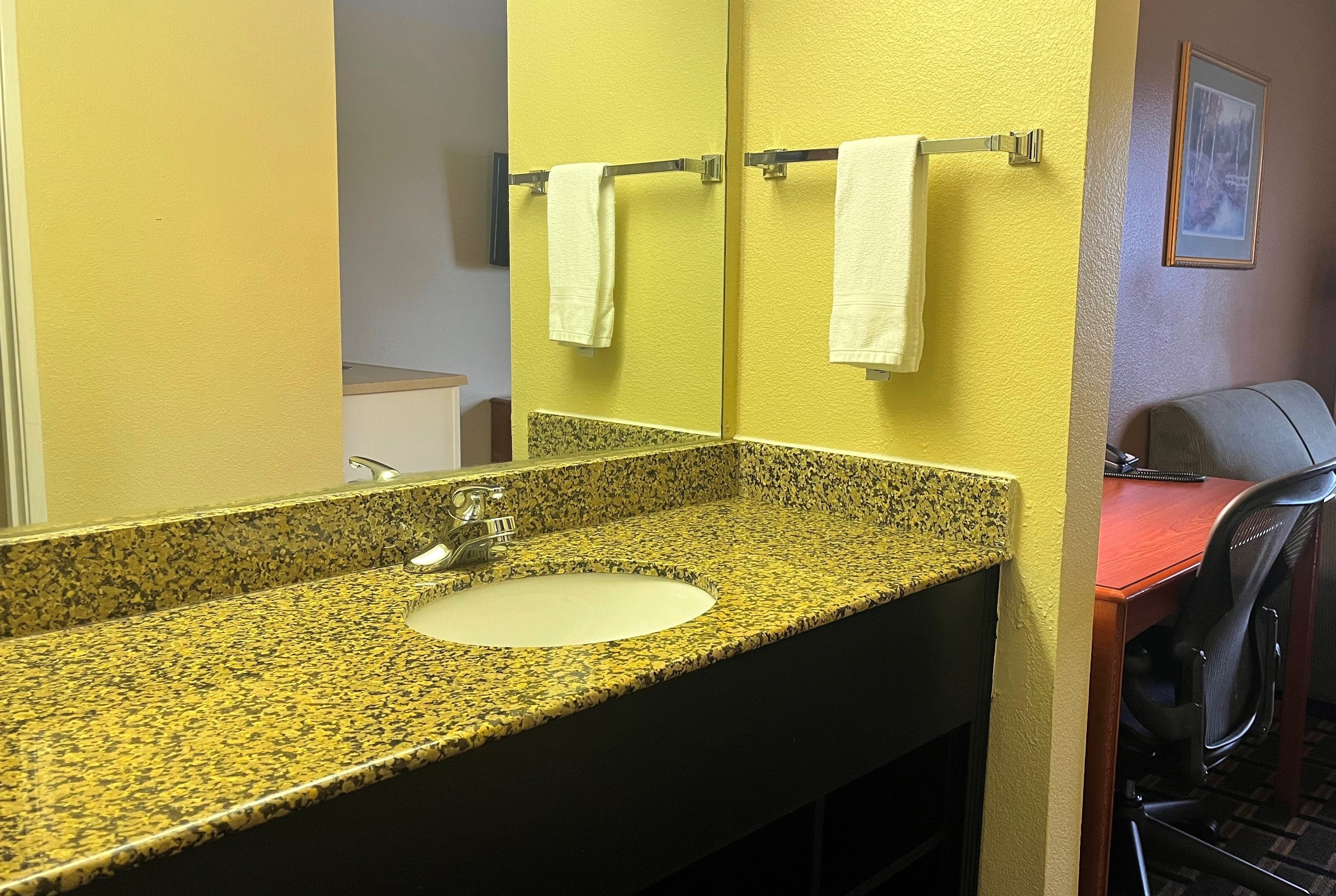 Guest room bath at the Super 8 by Wyndham Indianapolis/NE/Castleton Area in Indianapolis, Indiana