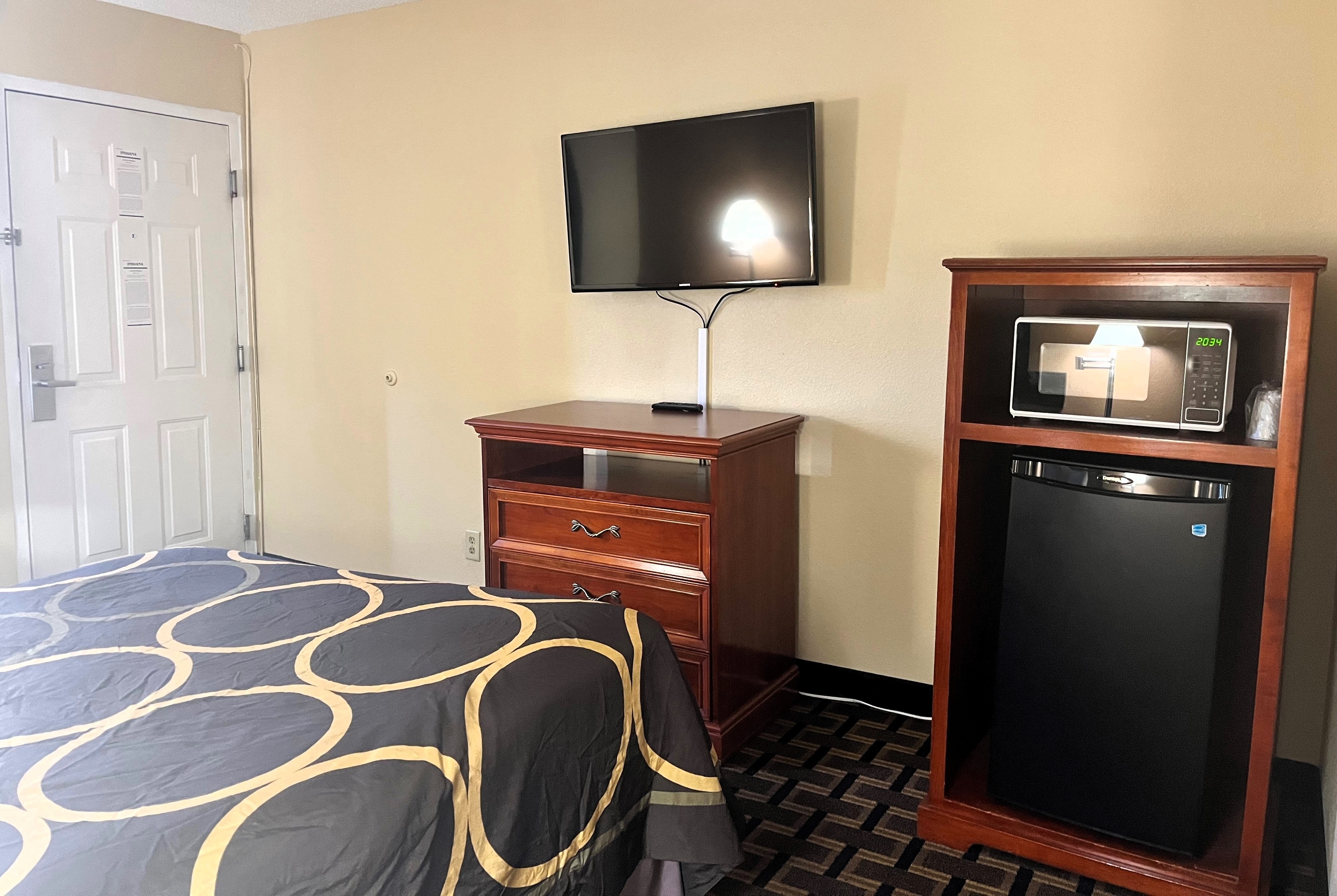 Guest room at the Super 8 by Wyndham Indianapolis/NE/Castleton Area in Indianapolis, Indiana