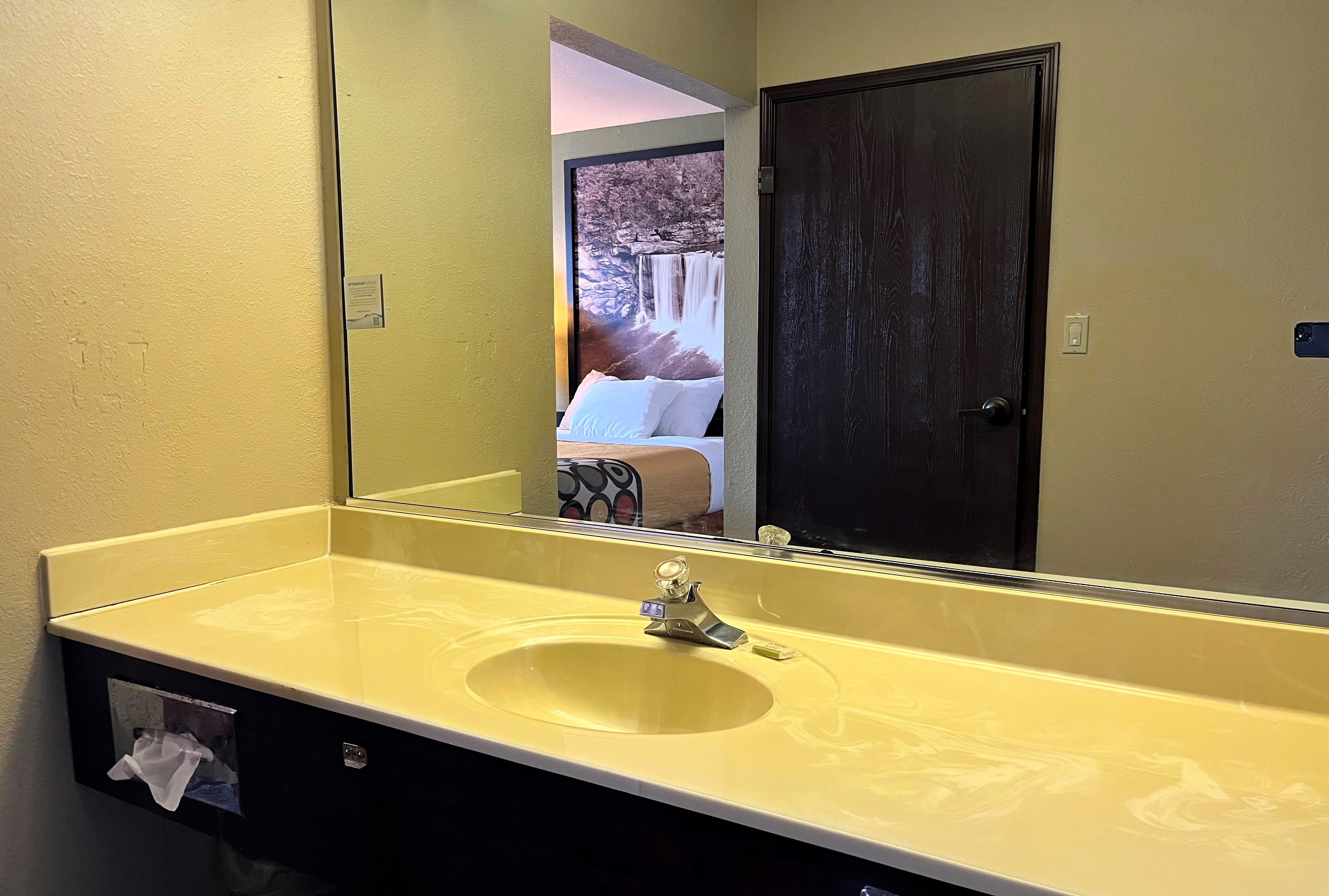 Guest room bath at the Super 8 by Wyndham Madison IN in Madison, Indiana
