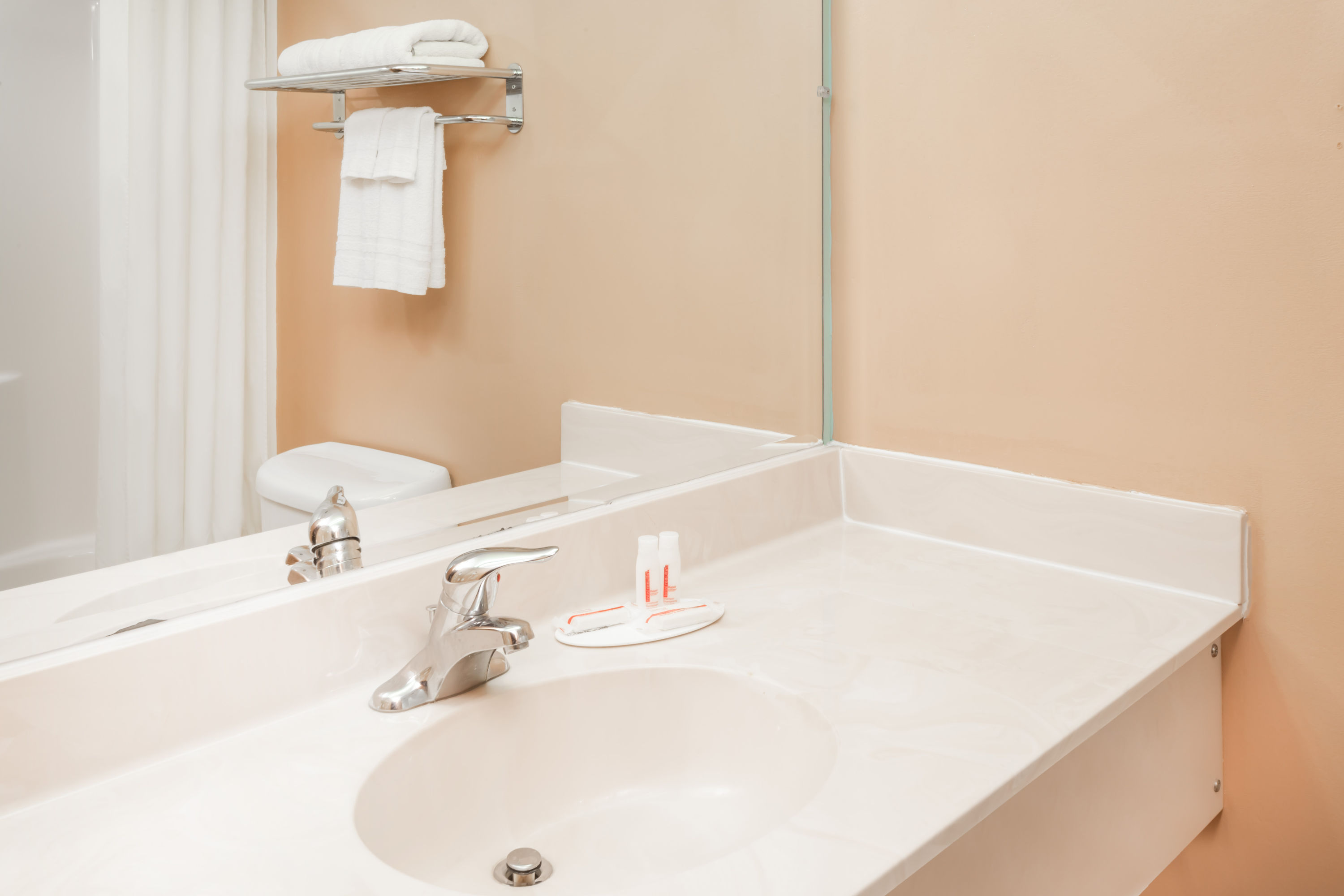 Guest room bath at the Super 8 by Wyndham Shipshewana in Shipshewana, Indiana