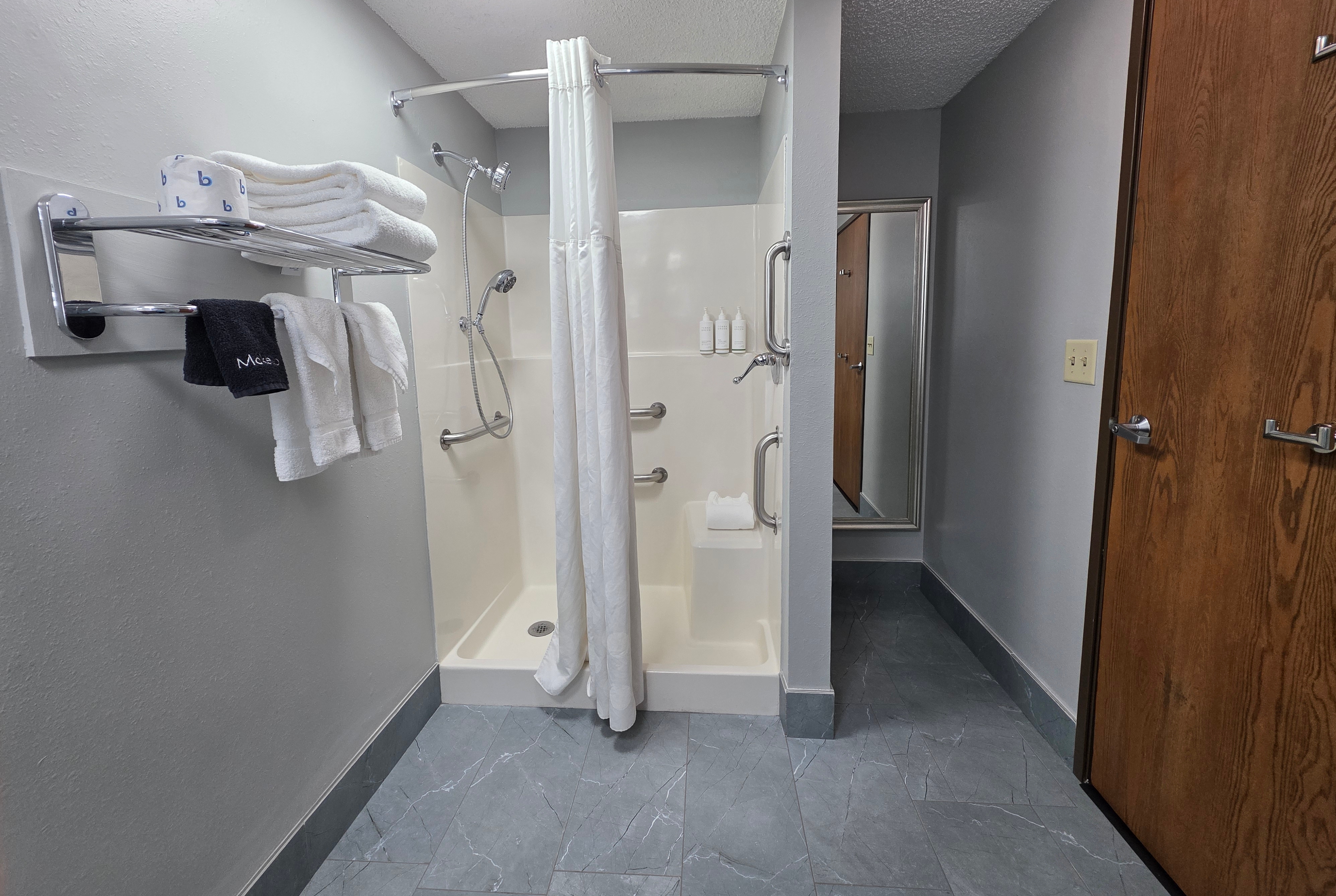 Guest room bath at the Super 8 by Wyndham Emporia in Emporia, Kansas