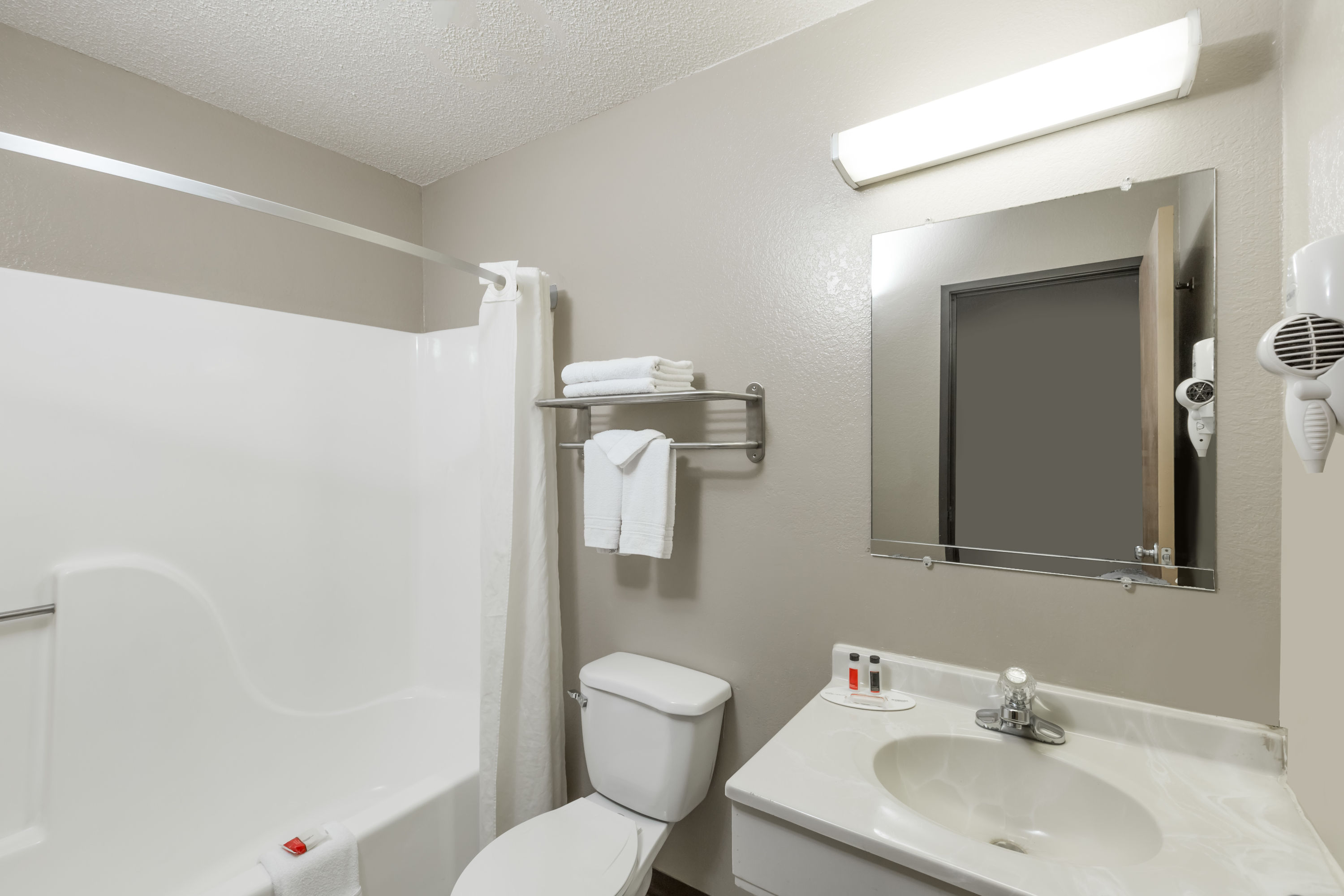 Guest room bath at the Super 8 by Wyndham Hays KS in Hays, Kansas