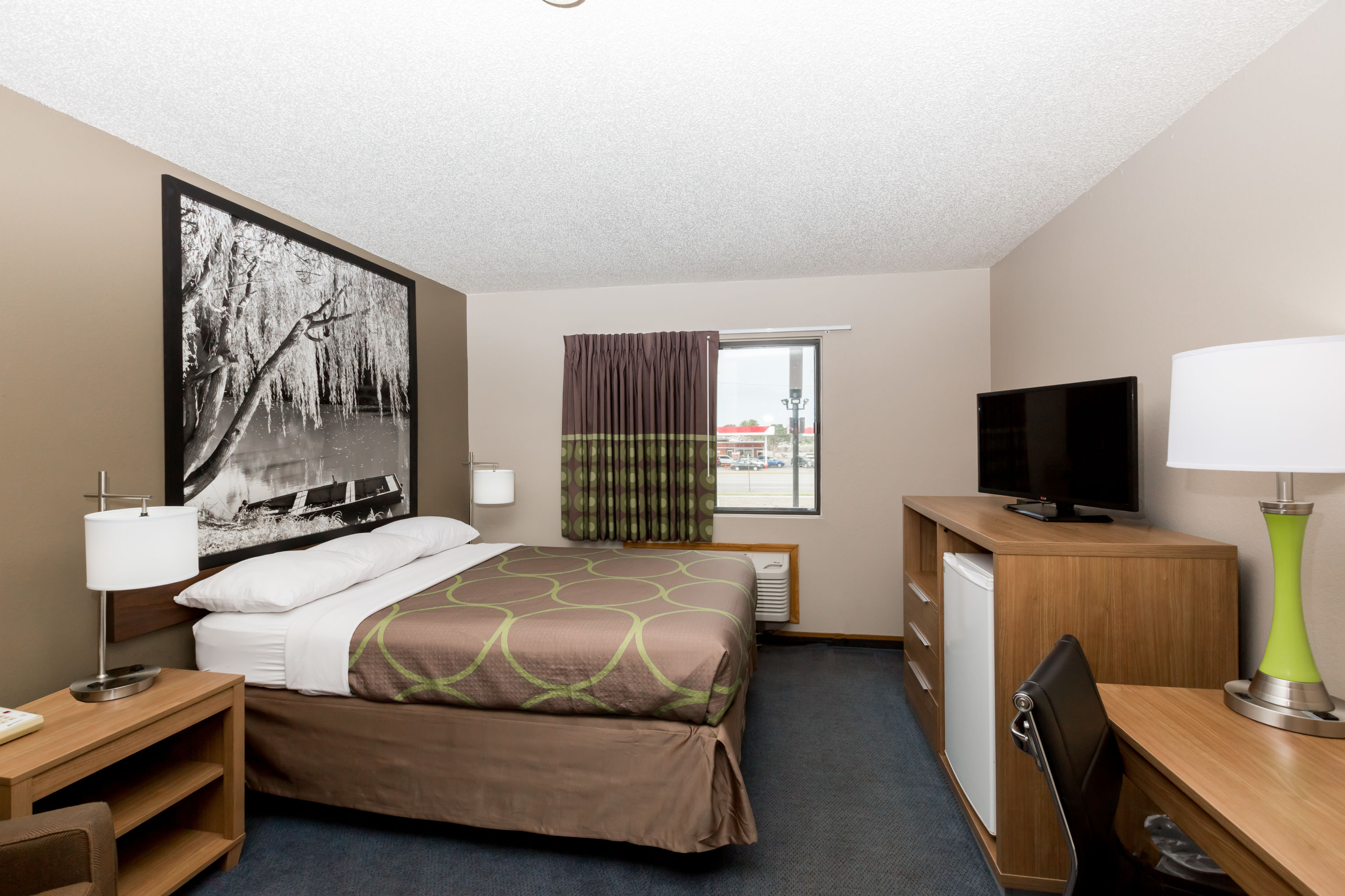 Guest room at the Super 8 by Wyndham Hays KS in Hays, Kansas