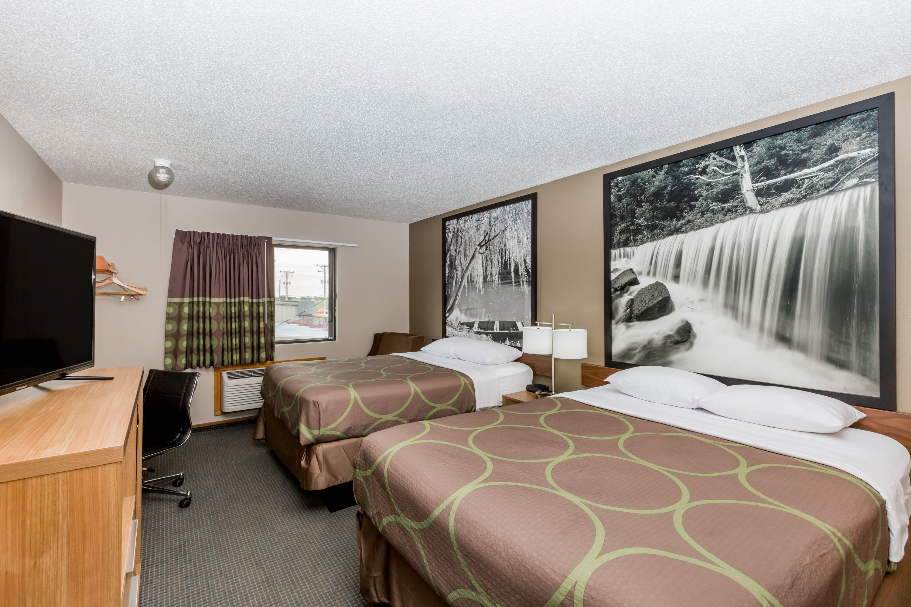 Guest room at the Super 8 by Wyndham Hays KS in Hays, Kansas