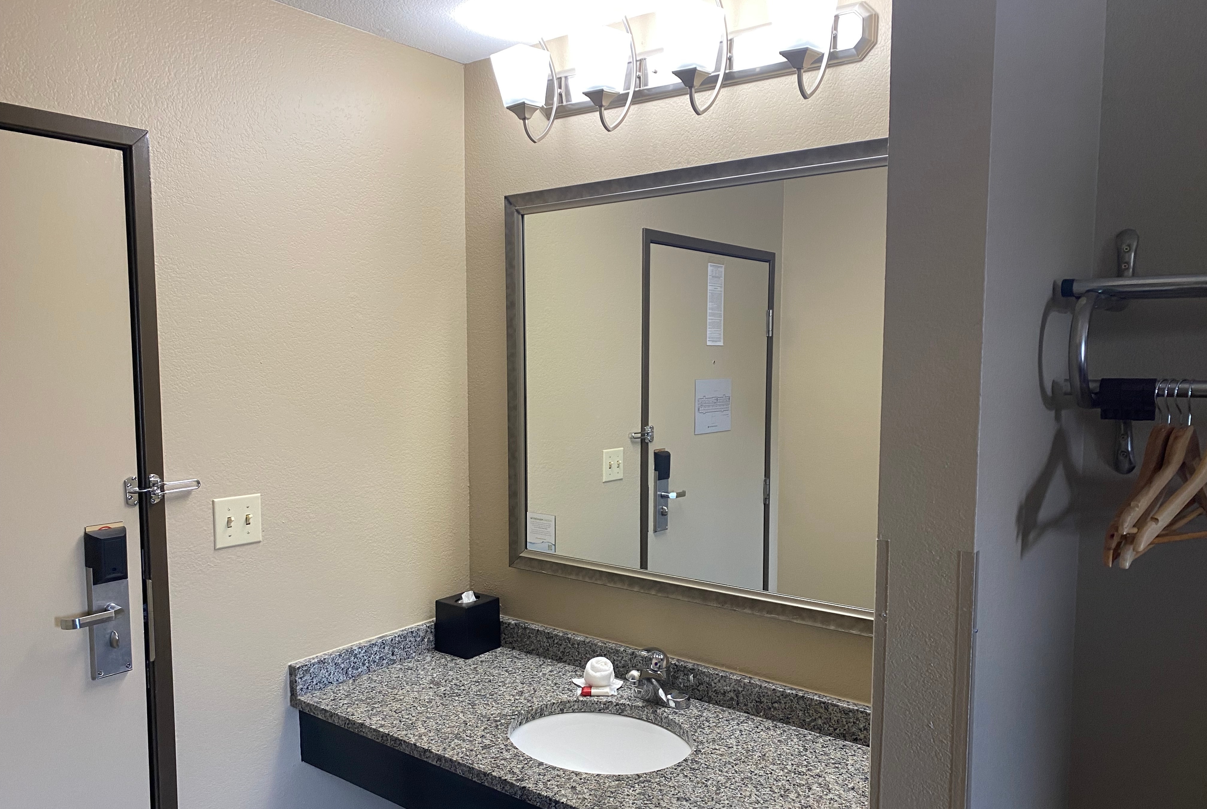 Guest room bath at the Super 8 by Wyndham Independence KS in Independence, Kansas