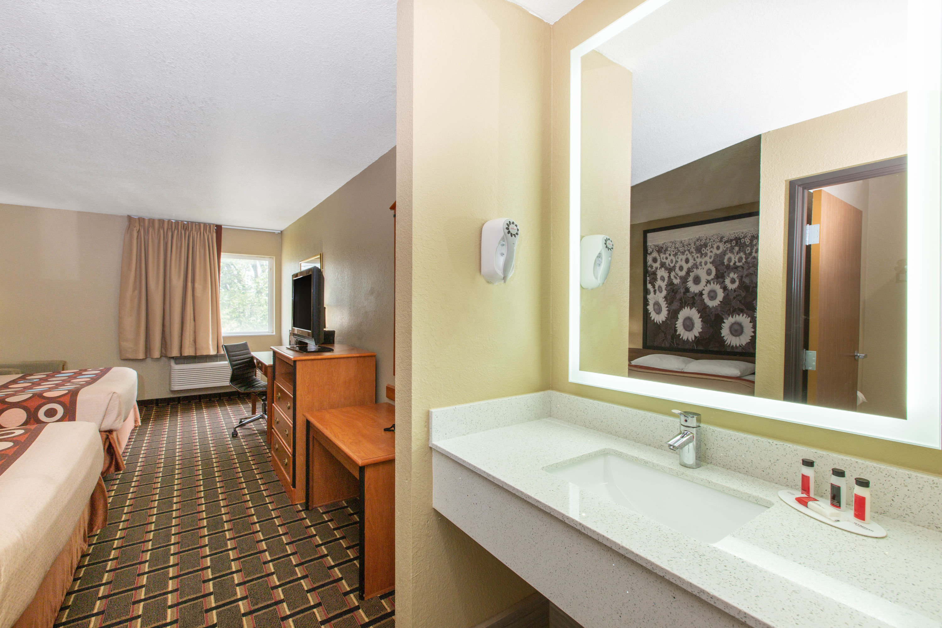 Guest room bath at the Super 8 by Wyndham Ottawa in Ottawa, Kansas