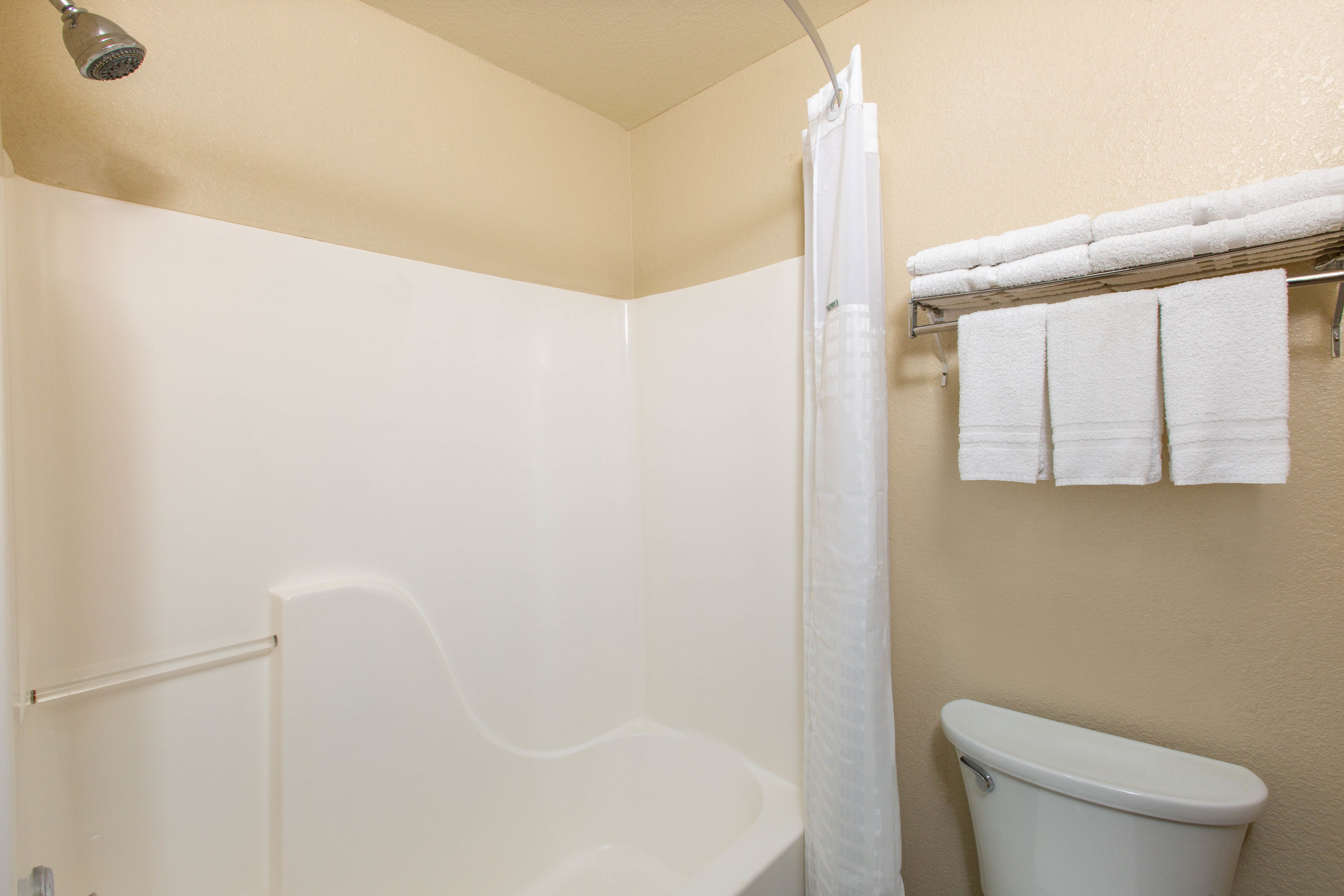 Guest room bath at the Super 8 by Wyndham Ottawa in Ottawa, Kansas