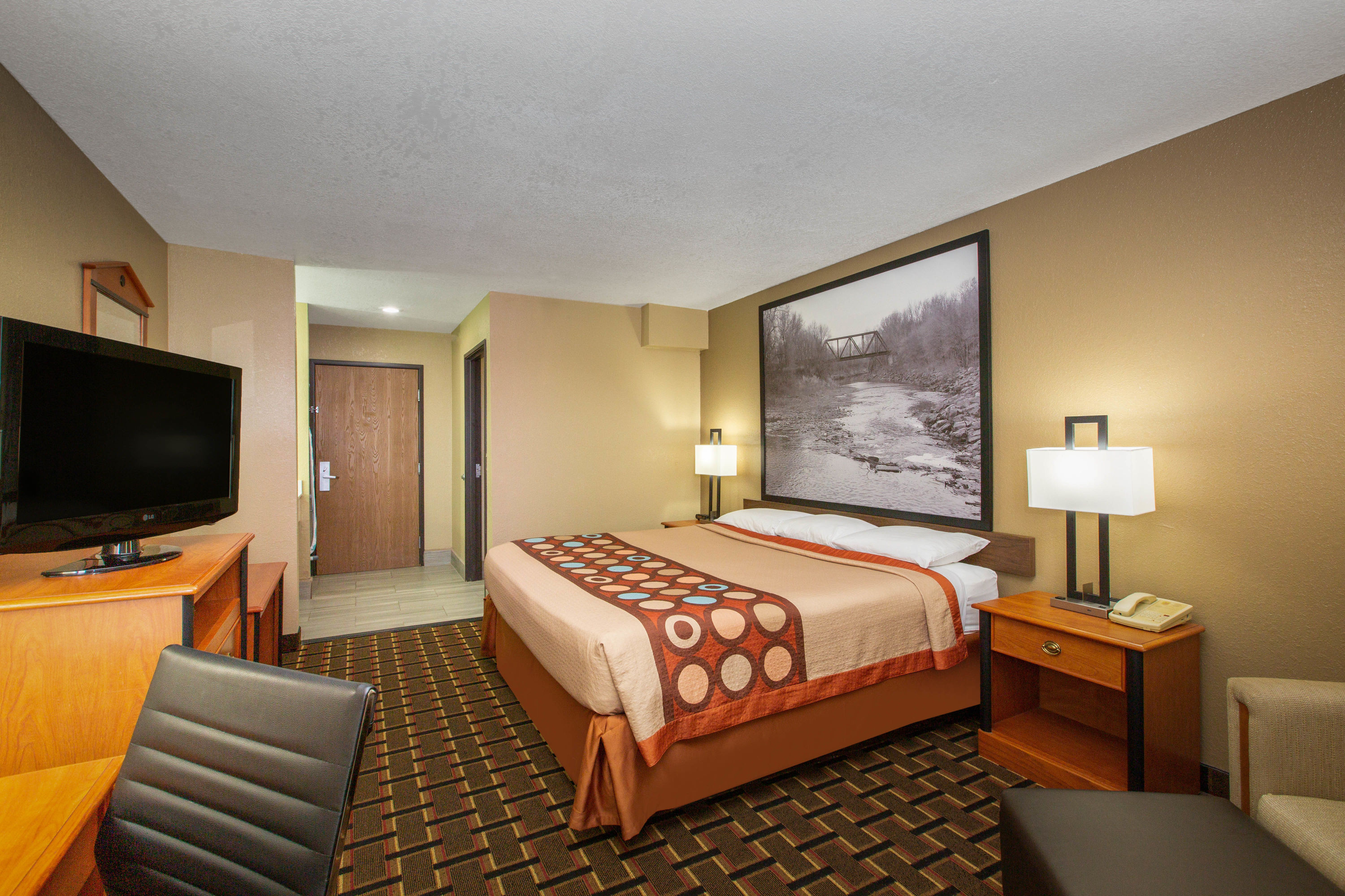 Guest room at the Super 8 by Wyndham Ottawa in Ottawa, Kansas