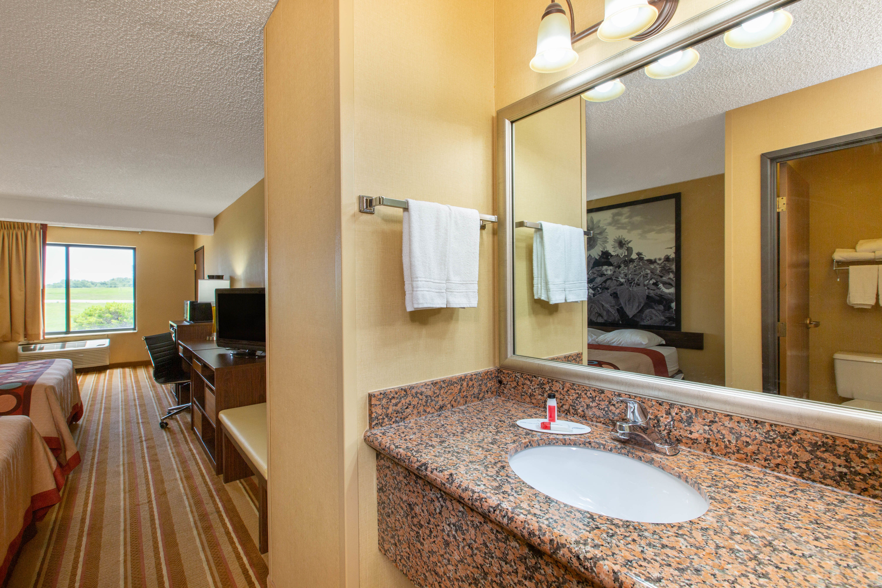 Guest room bath at the Super 8 by Wyndham Salina I-70 in Salina, Kansas