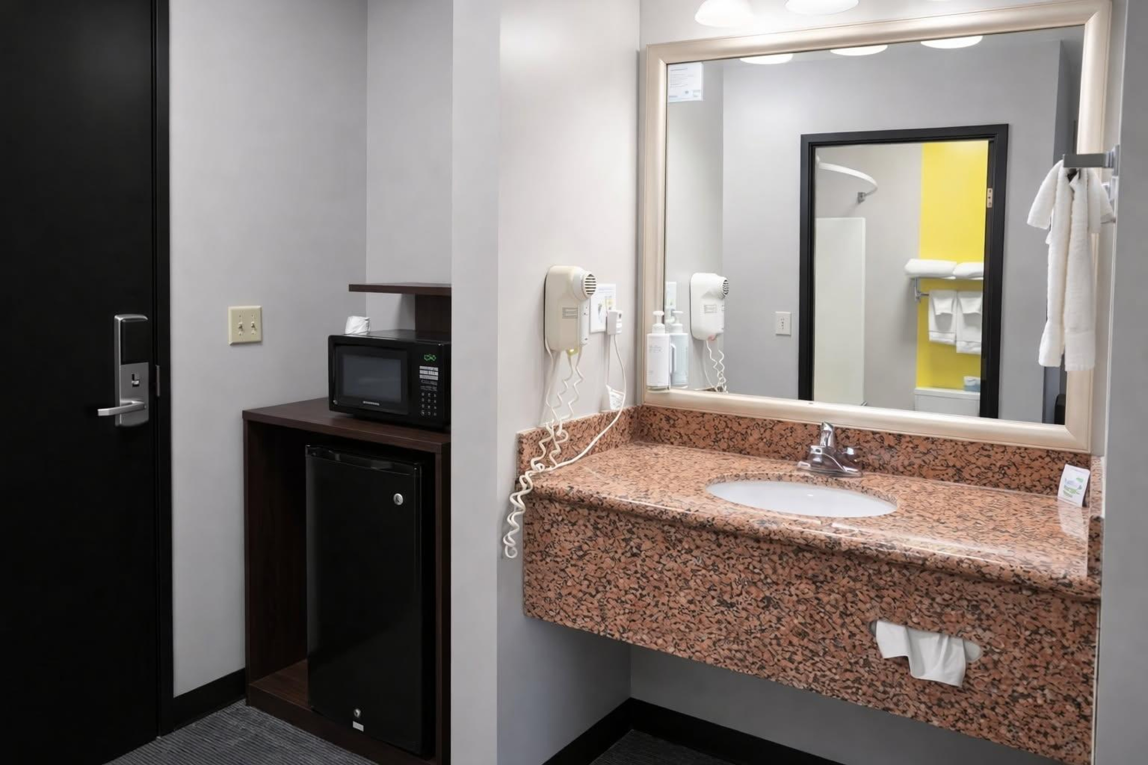 Guest room bath at the Super 8 by Wyndham Salina I-70 in Salina, Kansas