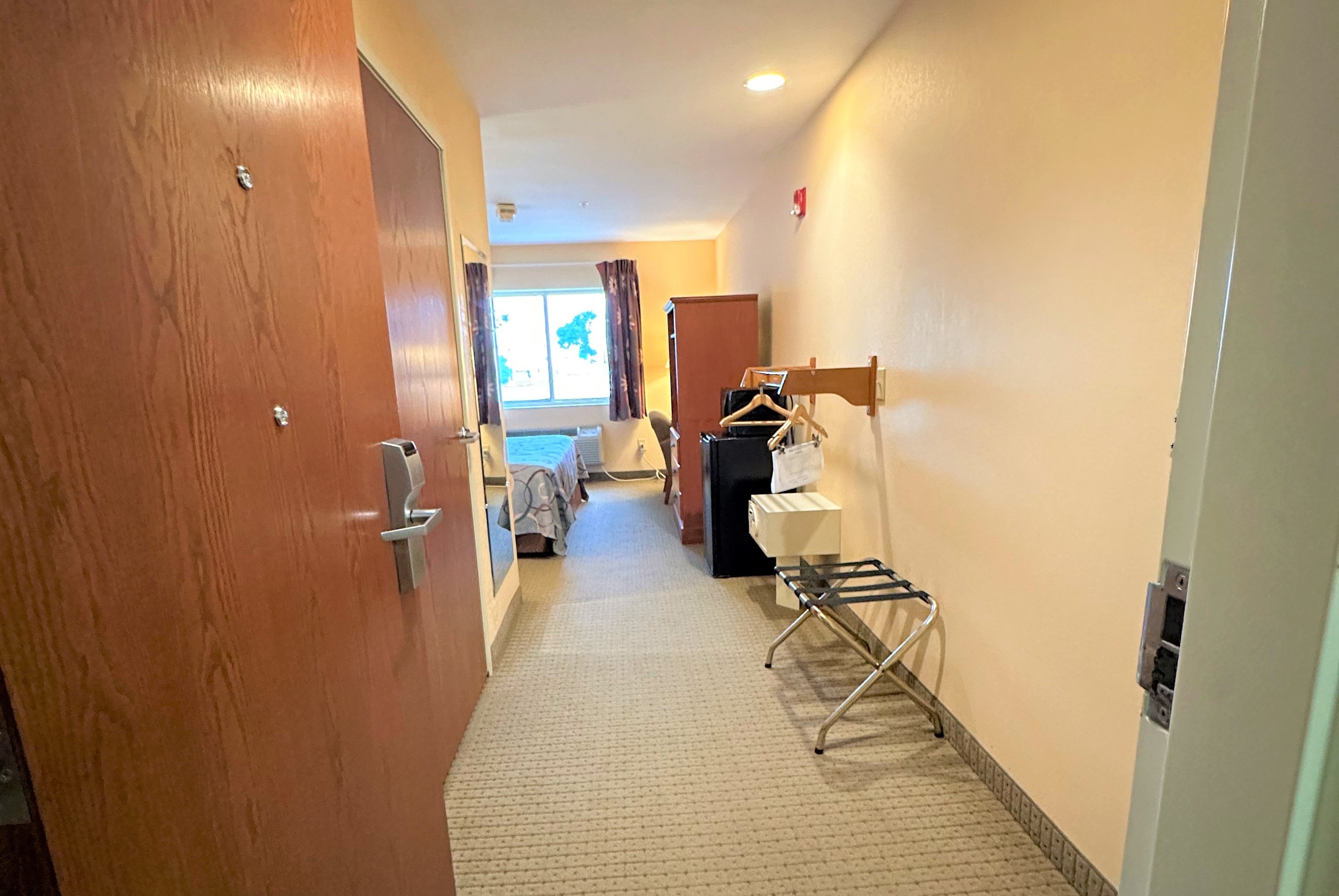 Guest room at the Super 8 by Wyndham Topeka at Forbes Landing in Topeka, Kansas