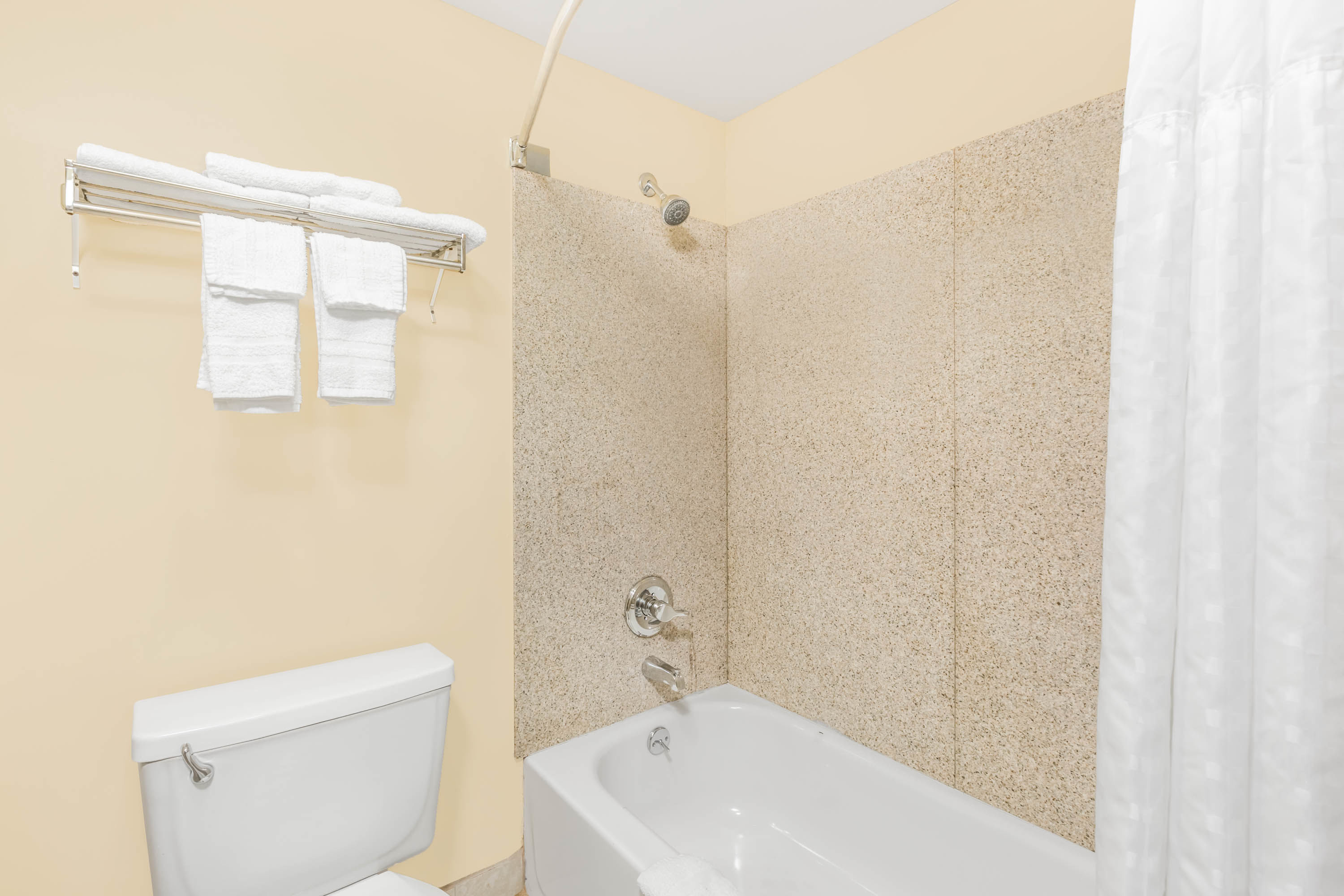 Guest room bath at the Super 8 by Wyndham Wichita Airport in Wichita, Kansas