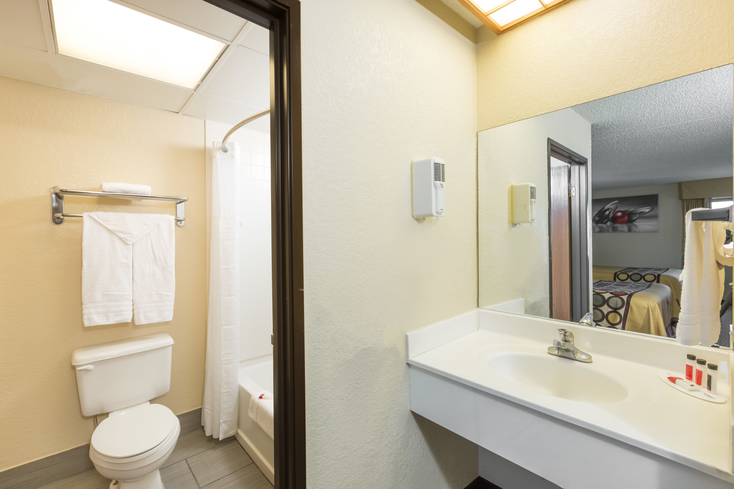 Guest room bath at the Super 8 by Wyndham Wichita North in Wichita, Kansas