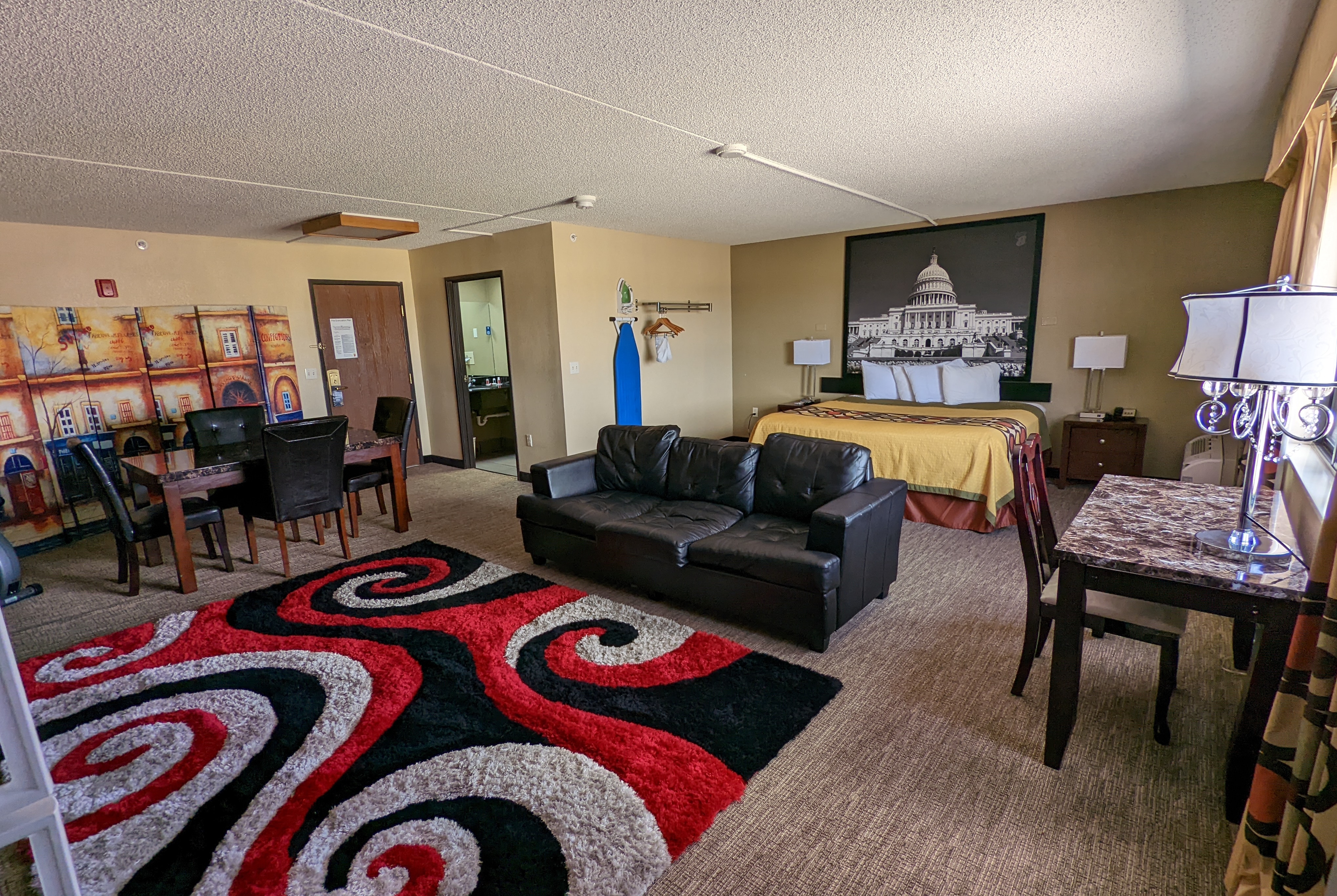 Super 8 by Wyndham Wichita North suite living room in Wichita, Kansas