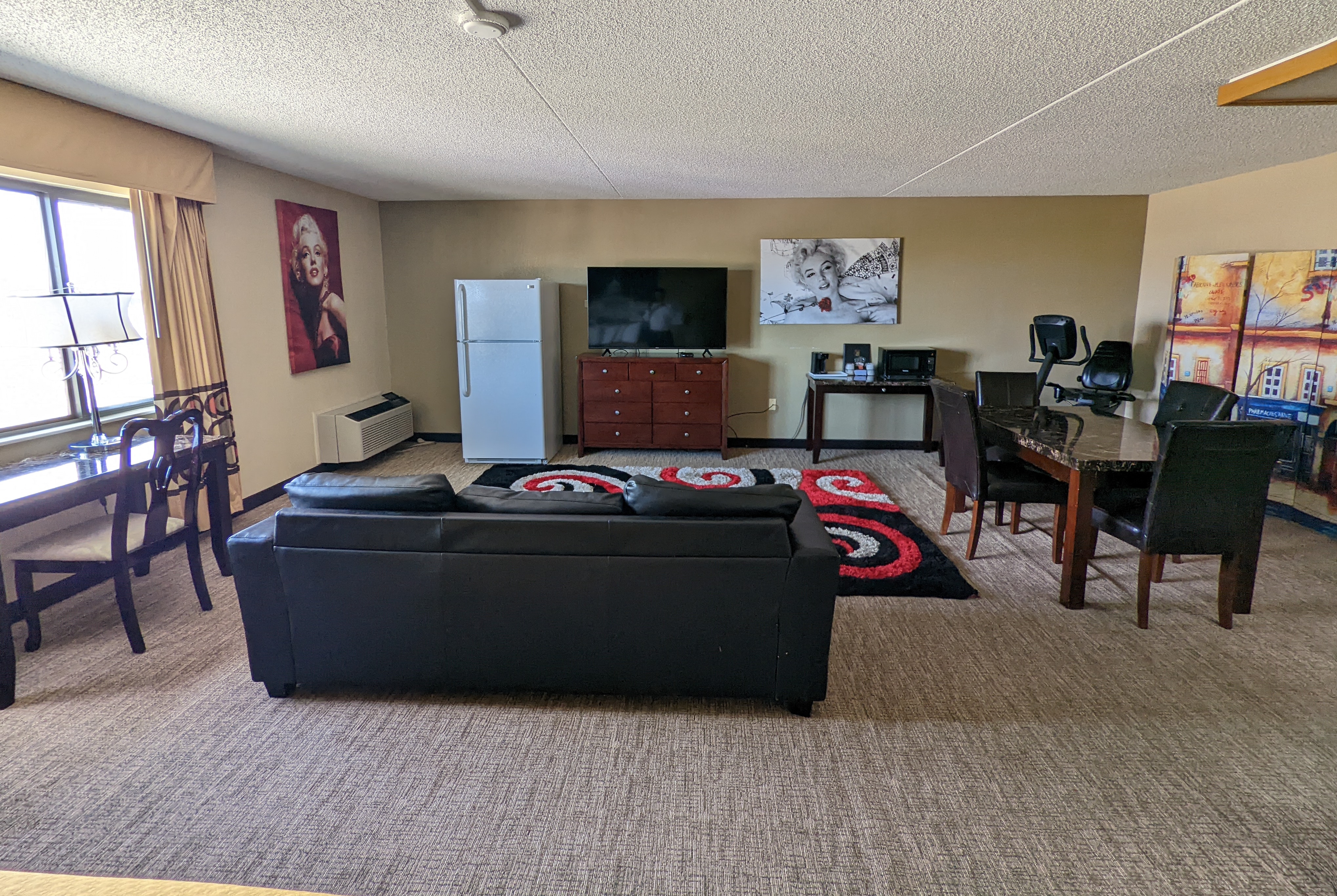 Super 8 by Wyndham Wichita North suite living room in Wichita, Kansas