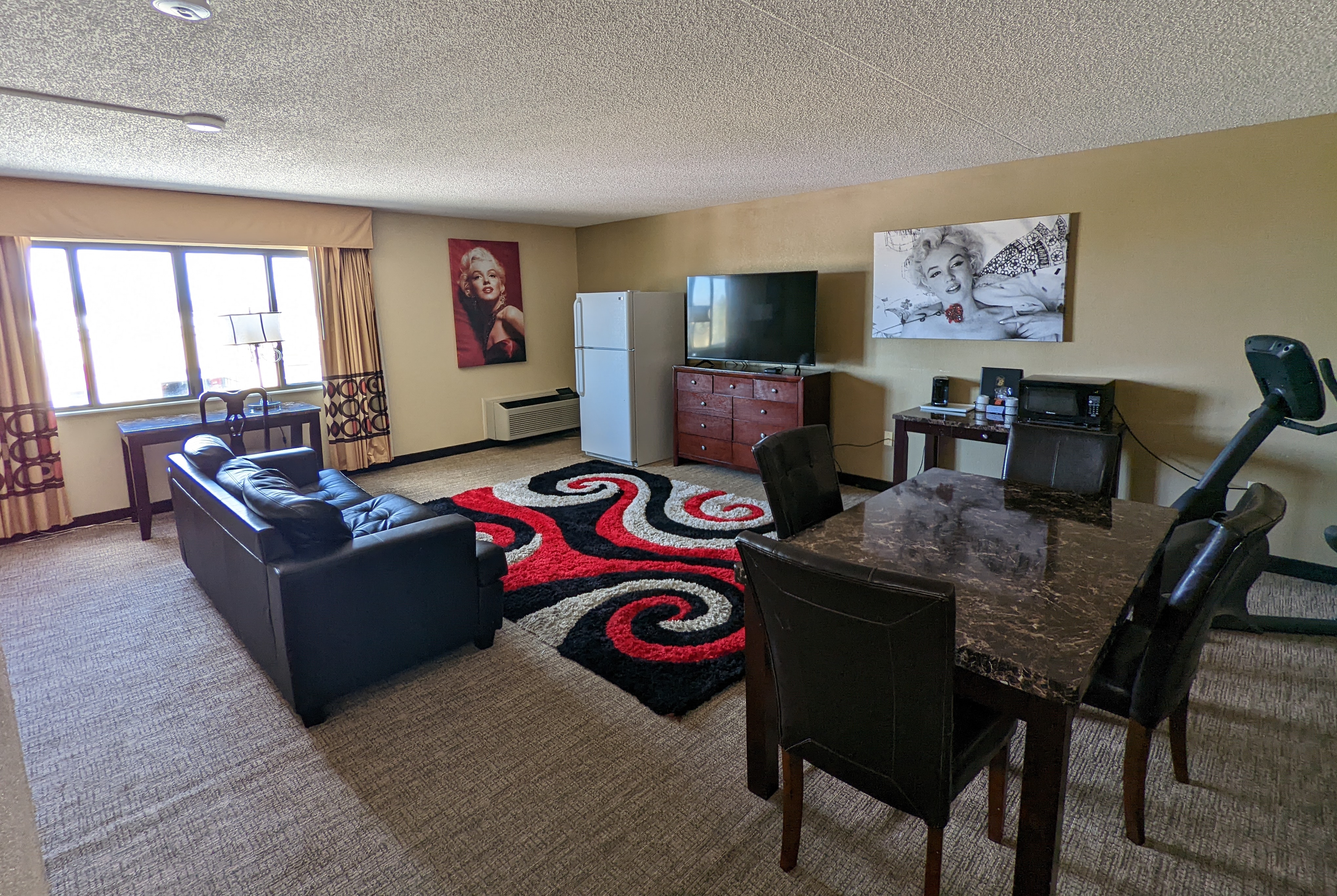 Super 8 by Wyndham Wichita North suite living room in Wichita, Kansas