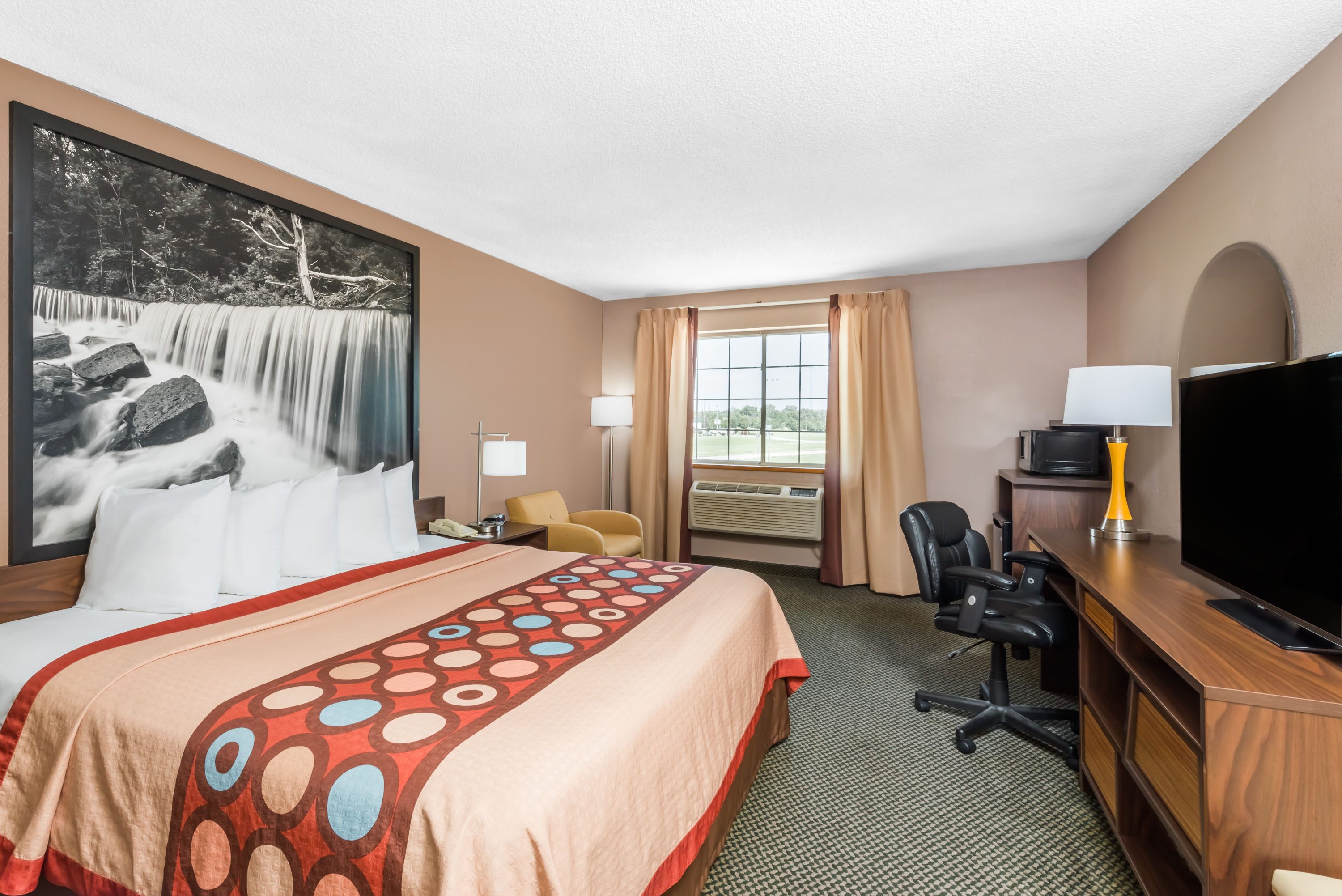 Guest room at the Super 8 by Wyndham Winfield/Quail Ridge Area in Winfield, Kansas