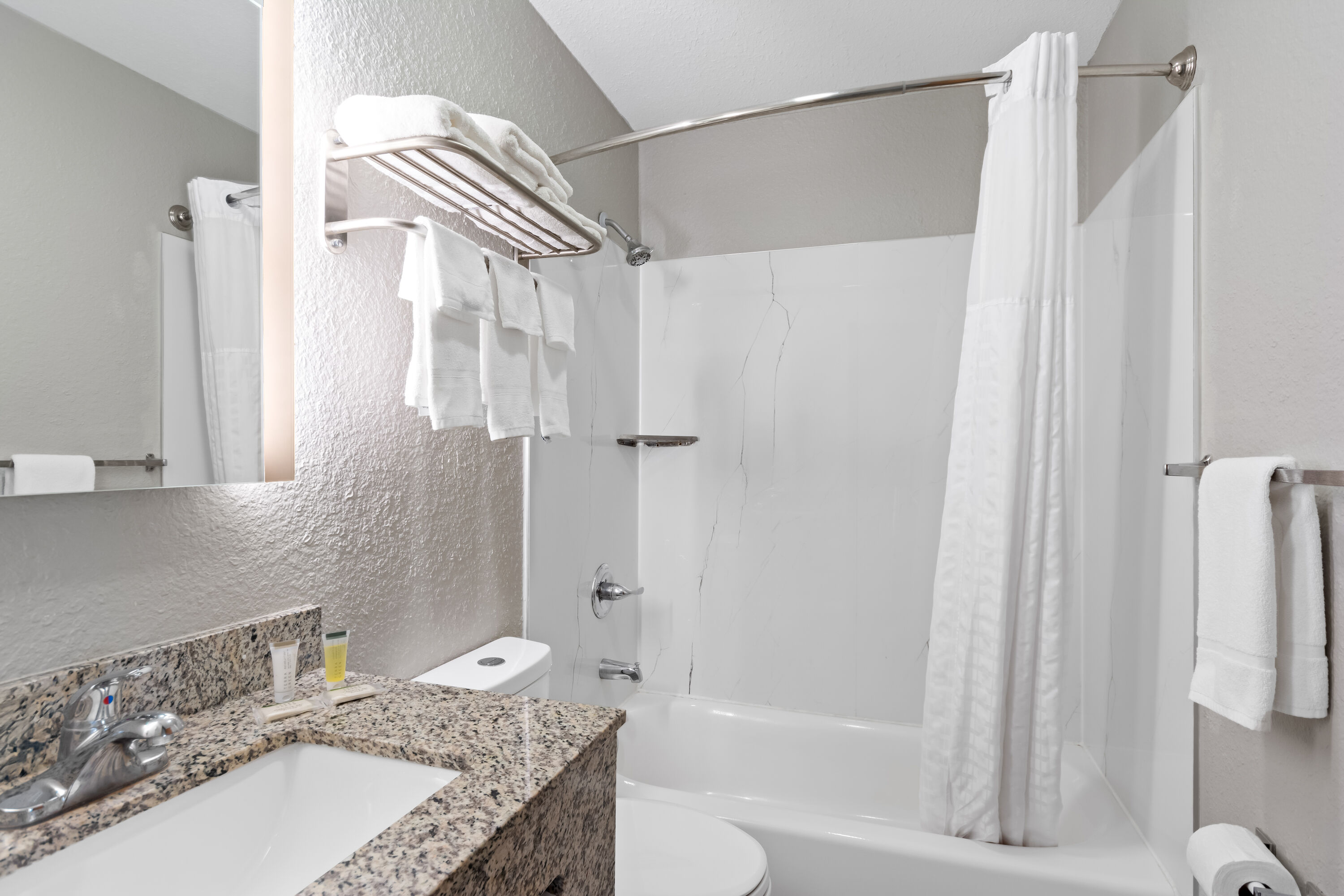 Guest room bath at the Super 8 by Wyndham Elizabethtown in Elizabethtown, Kentucky