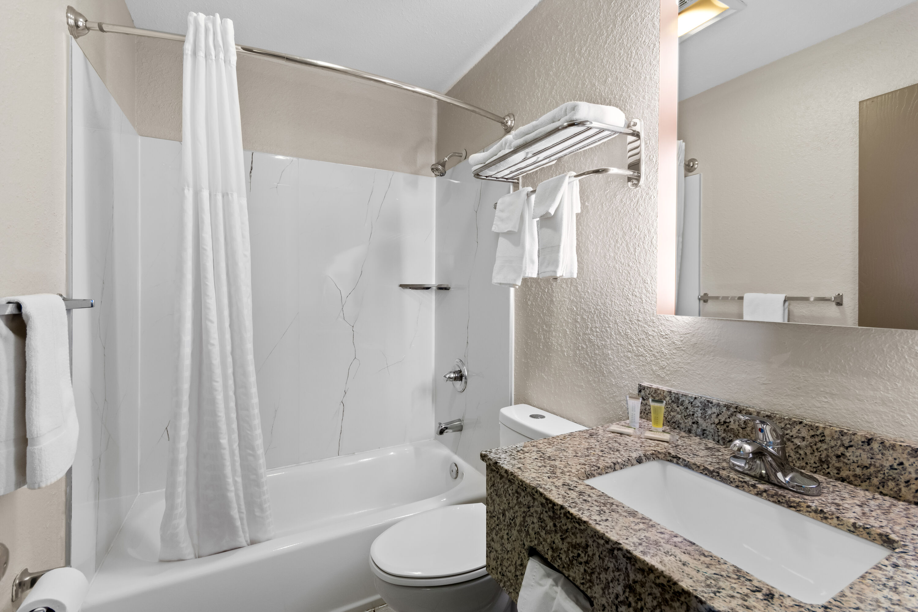 Guest room bath at the Super 8 by Wyndham Elizabethtown in Elizabethtown, Kentucky