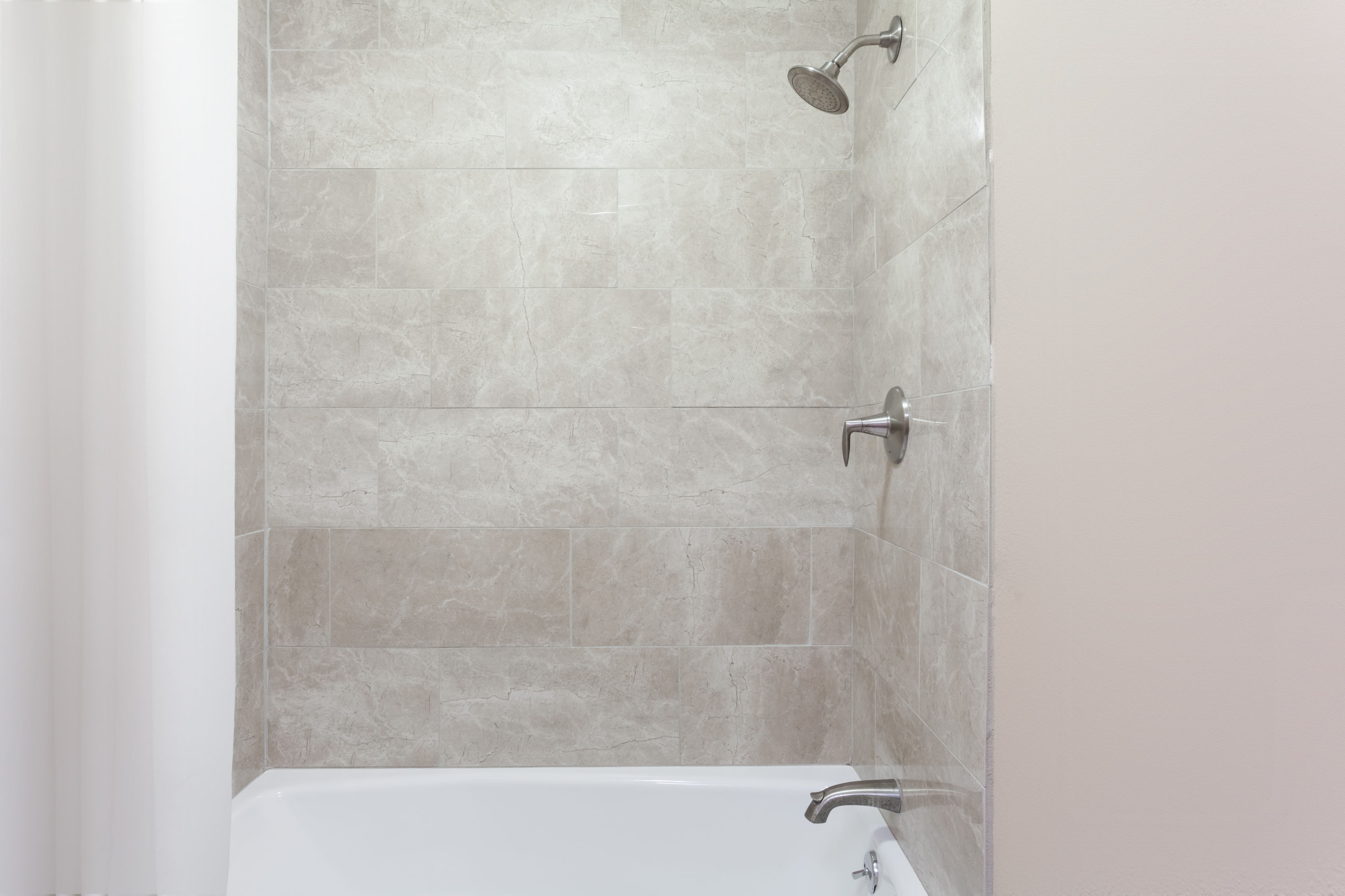 Guest room bath at the Super 8 by Wyndham Owensboro in Owensboro, Kentucky