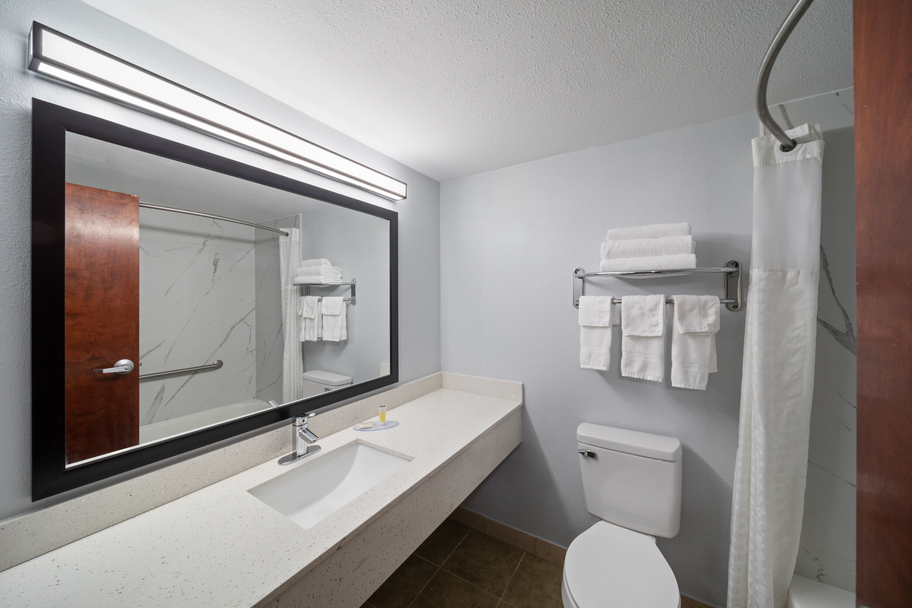 Guest room bath at the Super 8 by Wyndham Alexandria LA in Alexandria, Louisiana