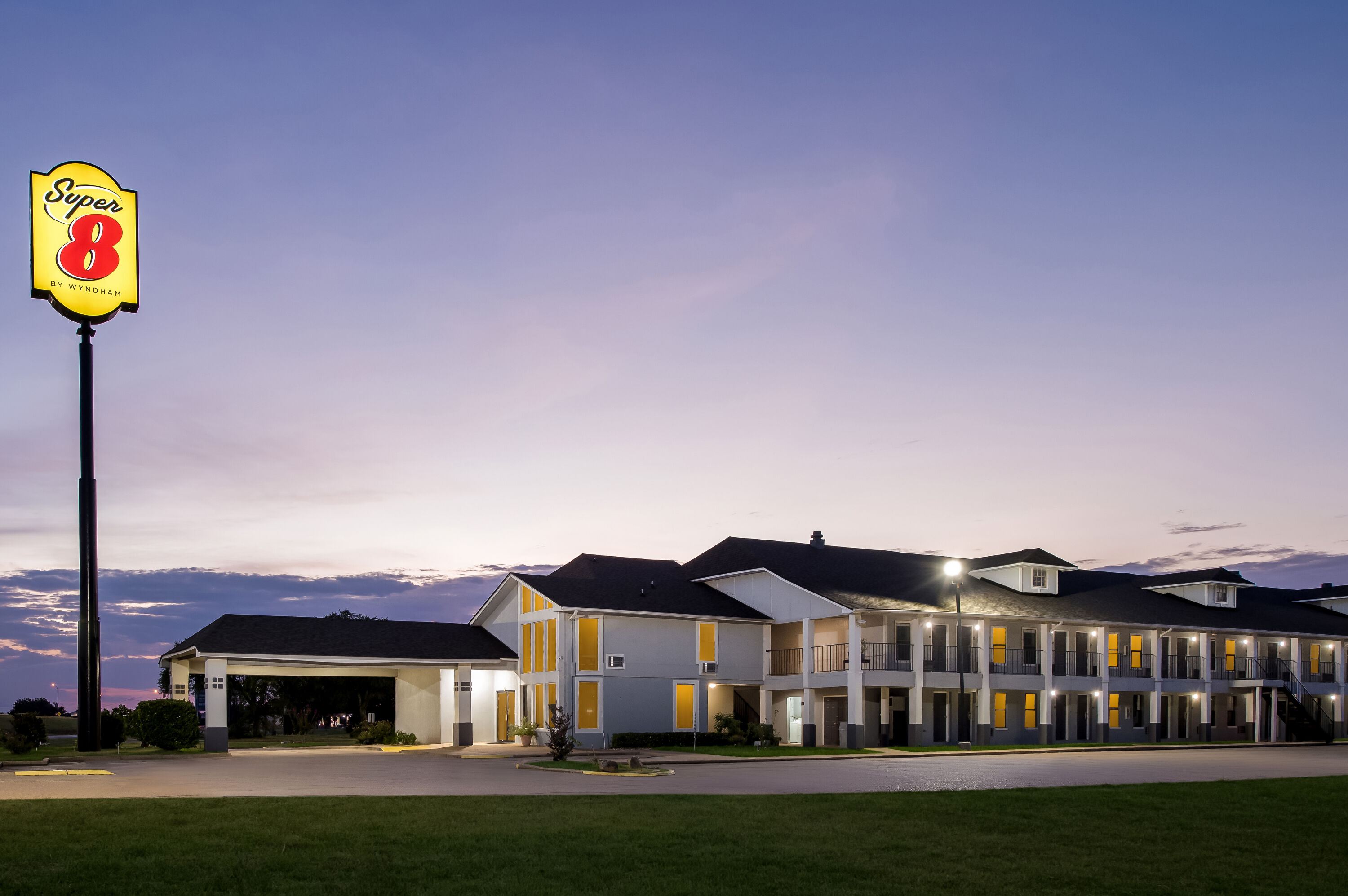 Exterior Night Image of Super 8 by Wyndham Bossier City/Shreveport Area hotel in Bossier City, Louisiana