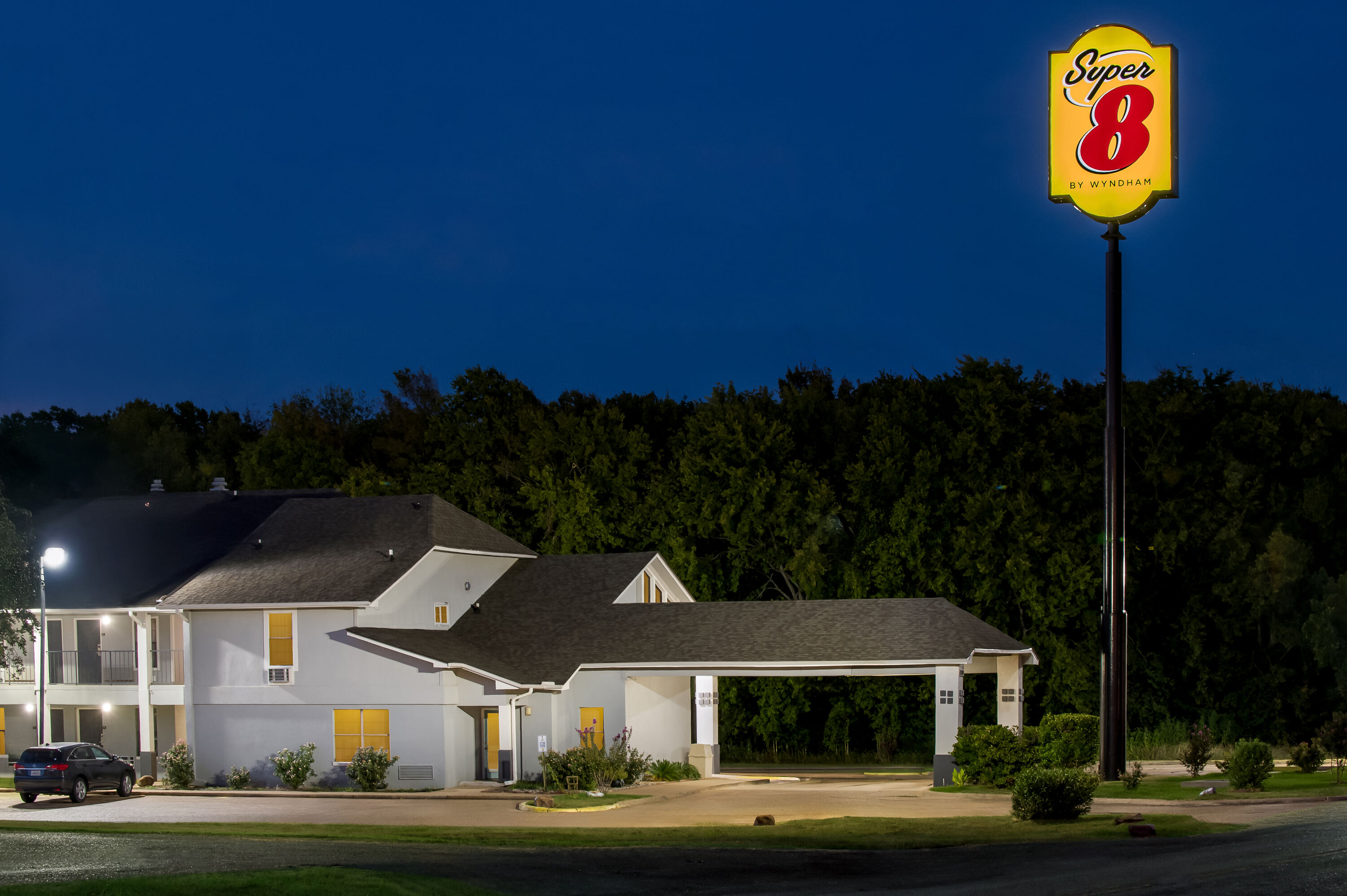 Exterior Night Image of Super 8 by Wyndham Bossier City/Shreveport Area hotel in Bossier City, Louisiana