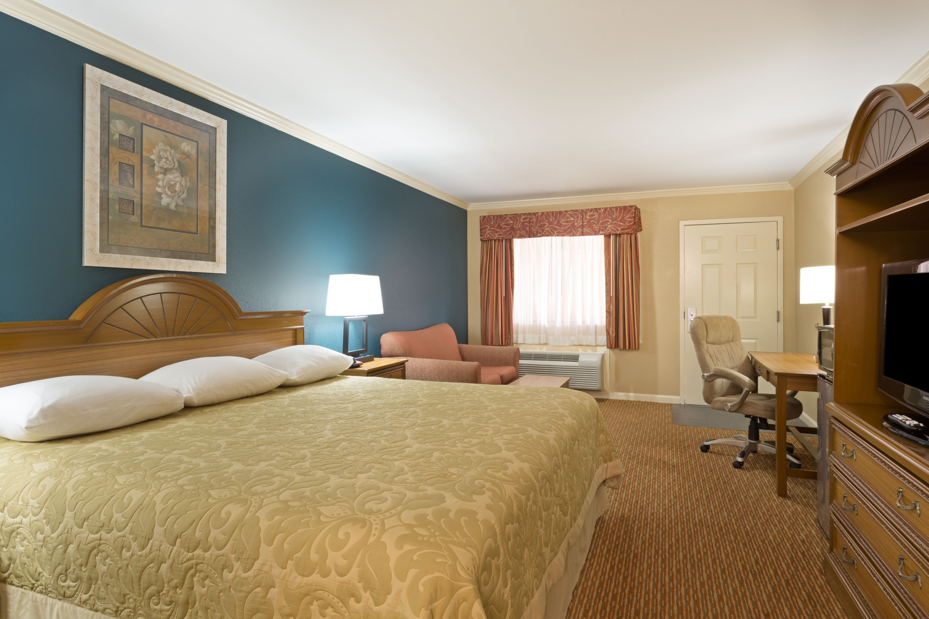 Guest room at the Super 8 by Wyndham Covington in Covington, Louisiana