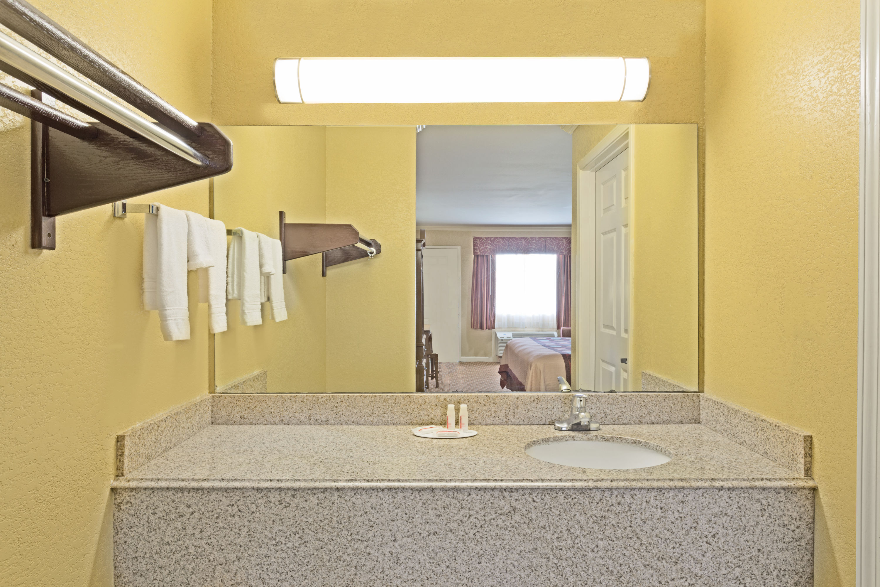 Guest room at the Super 8 by Wyndham Covington in Covington, Louisiana