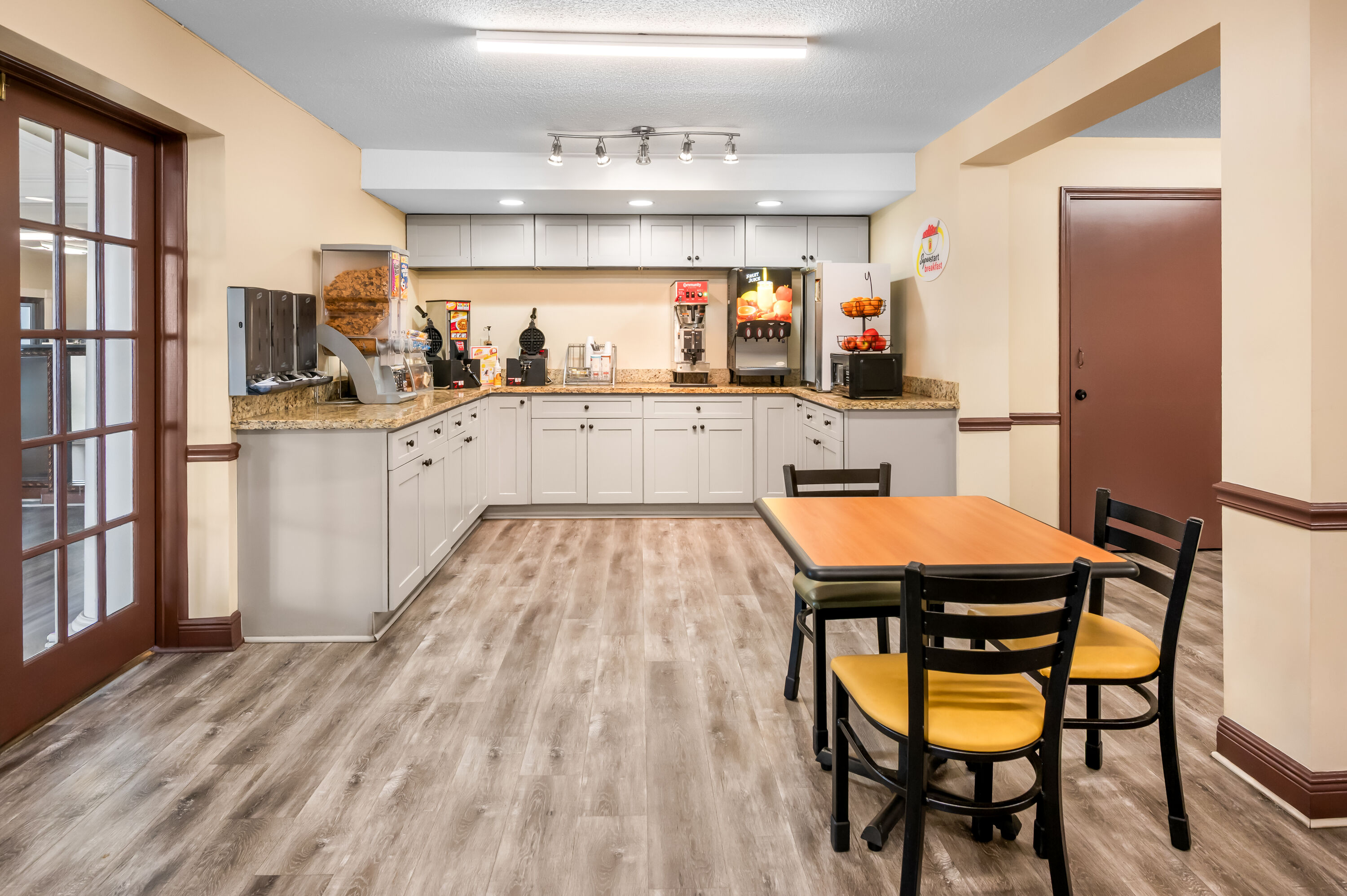 Super 8 by Wyndham Metairie restaurant breakfast area with seating in Metairie, Louisiana